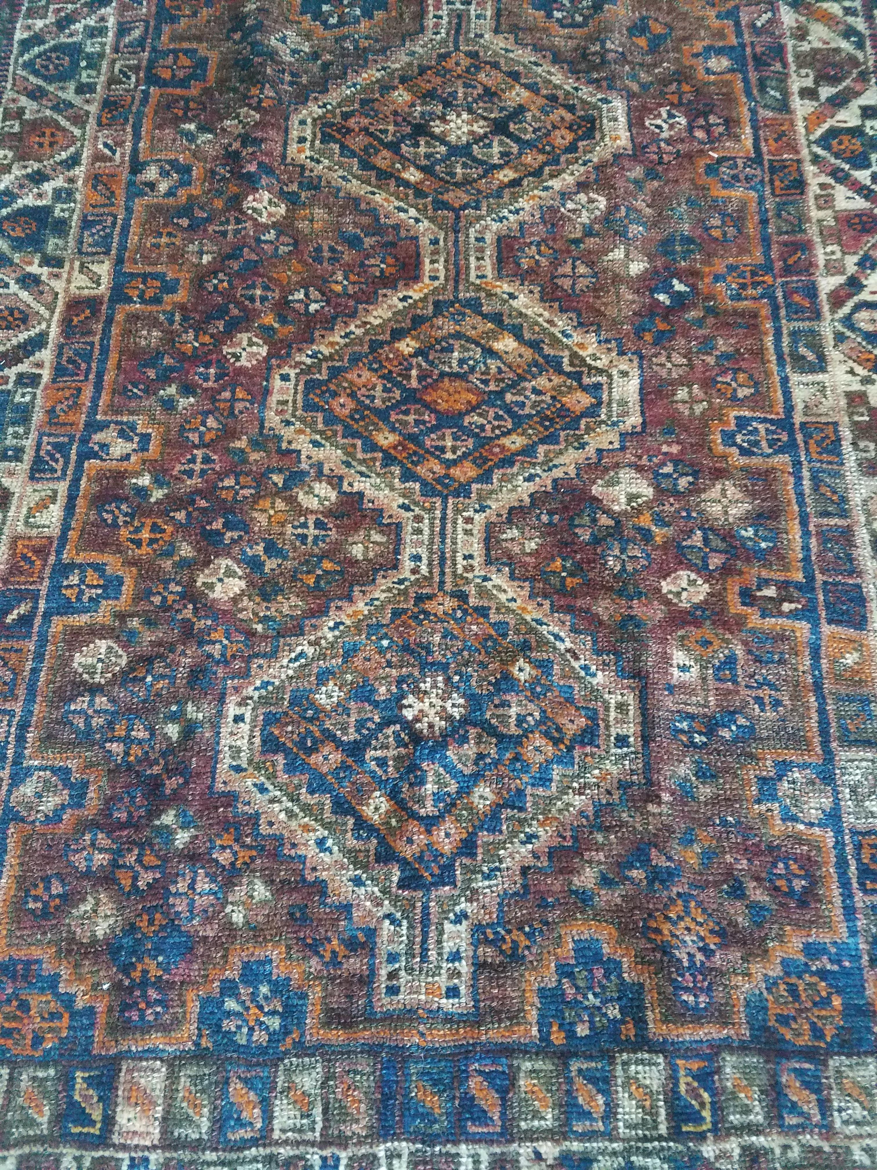 Stunning oriental area rug measuring approximately 60