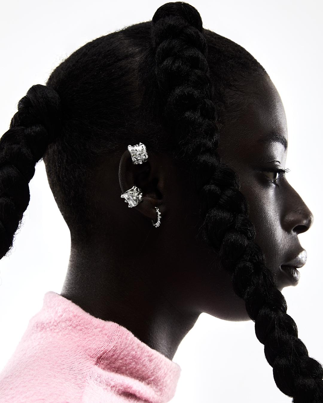 SO2 is a Silver ear cuff consisting of an organic shape with little spots.

This unique accessory is designed to adorn your ear without the need for piercings.

Sold individually, this ear cuff is a statement piece that stands out on its own. You