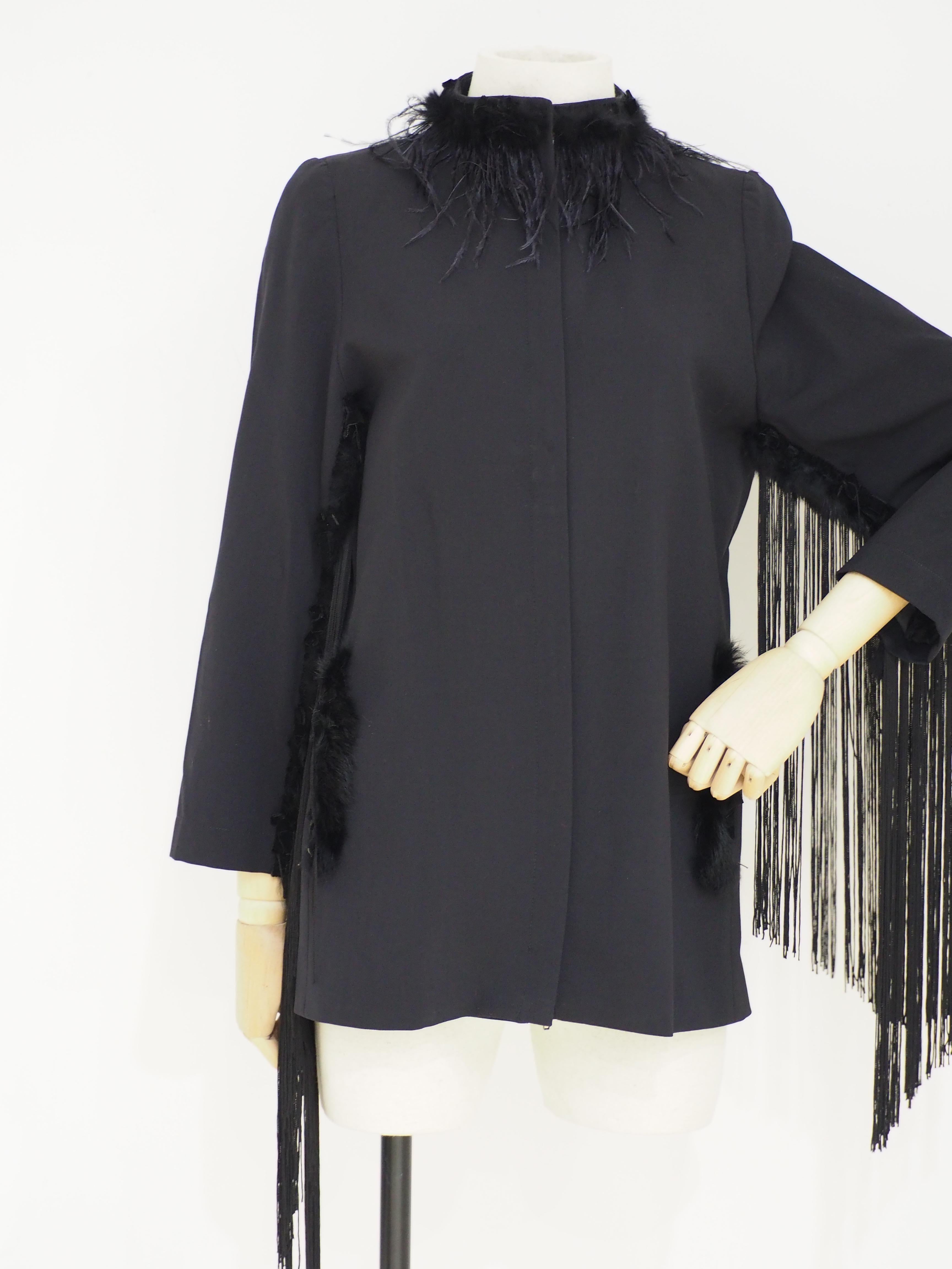 SOAB black feathers and fringes jacketa vintage Ferre black jacket embellished with contemporary feathers and fringes 
totally handmade
size 44
composition: Viscose