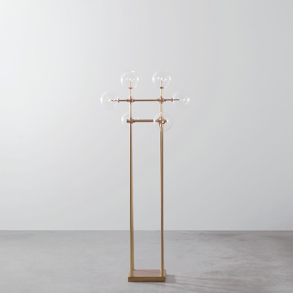 Brass 4 arm sculptural floor lamp by Schwung
Dimensions: D 74.3 x W 74.3 x H 167.8 cm
Materials: Solid brass, hand-blown glass globes
Finish: Natural Brass. 
Also available in finishes: Black Gunmetal or Polished Nickel. Please contact us for