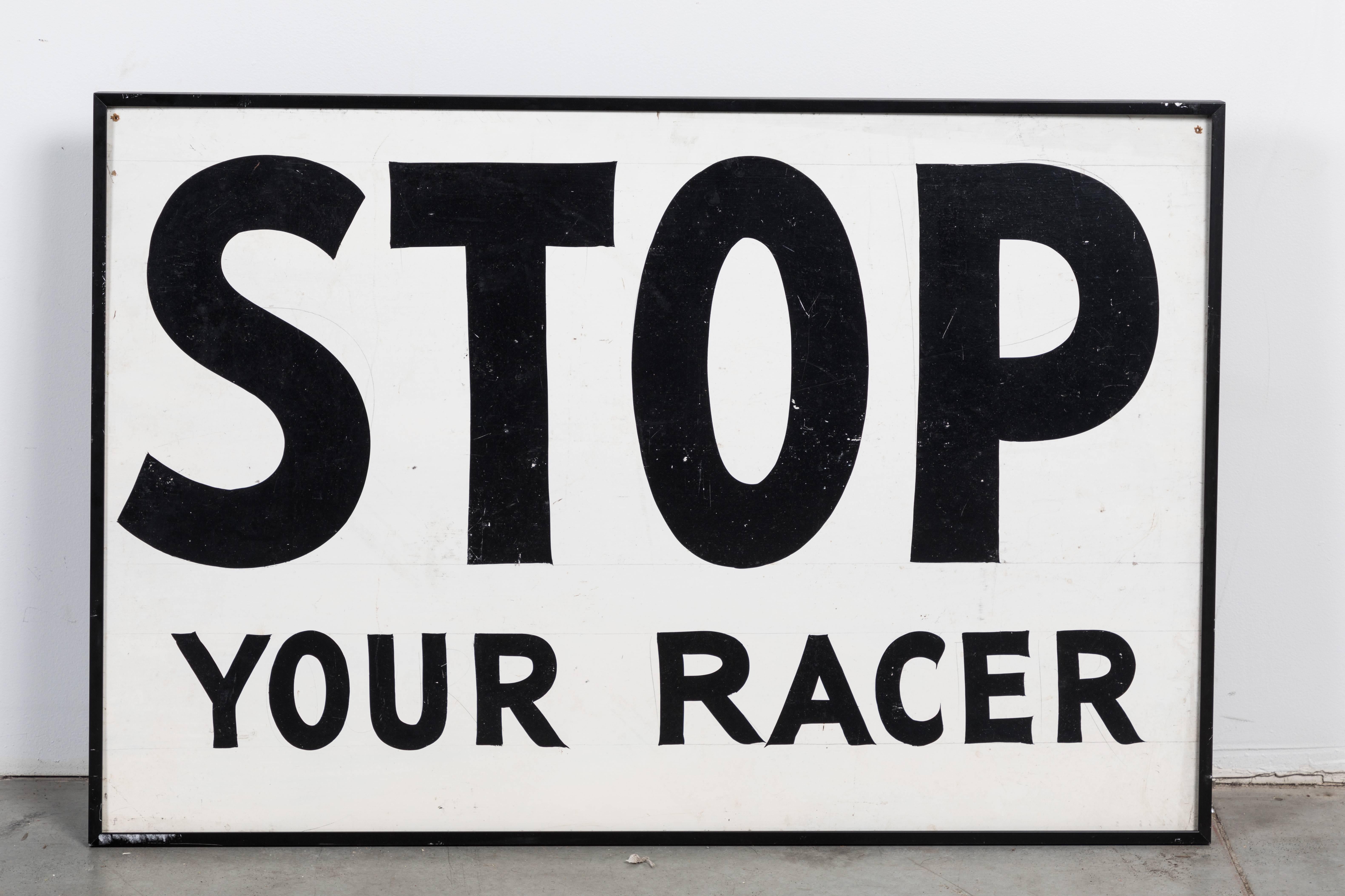 Graphic hand-painted signs. Most likely from an American soap box derby race track or perhaps carnival midway ride. Presented in black wraparound metal frame.
