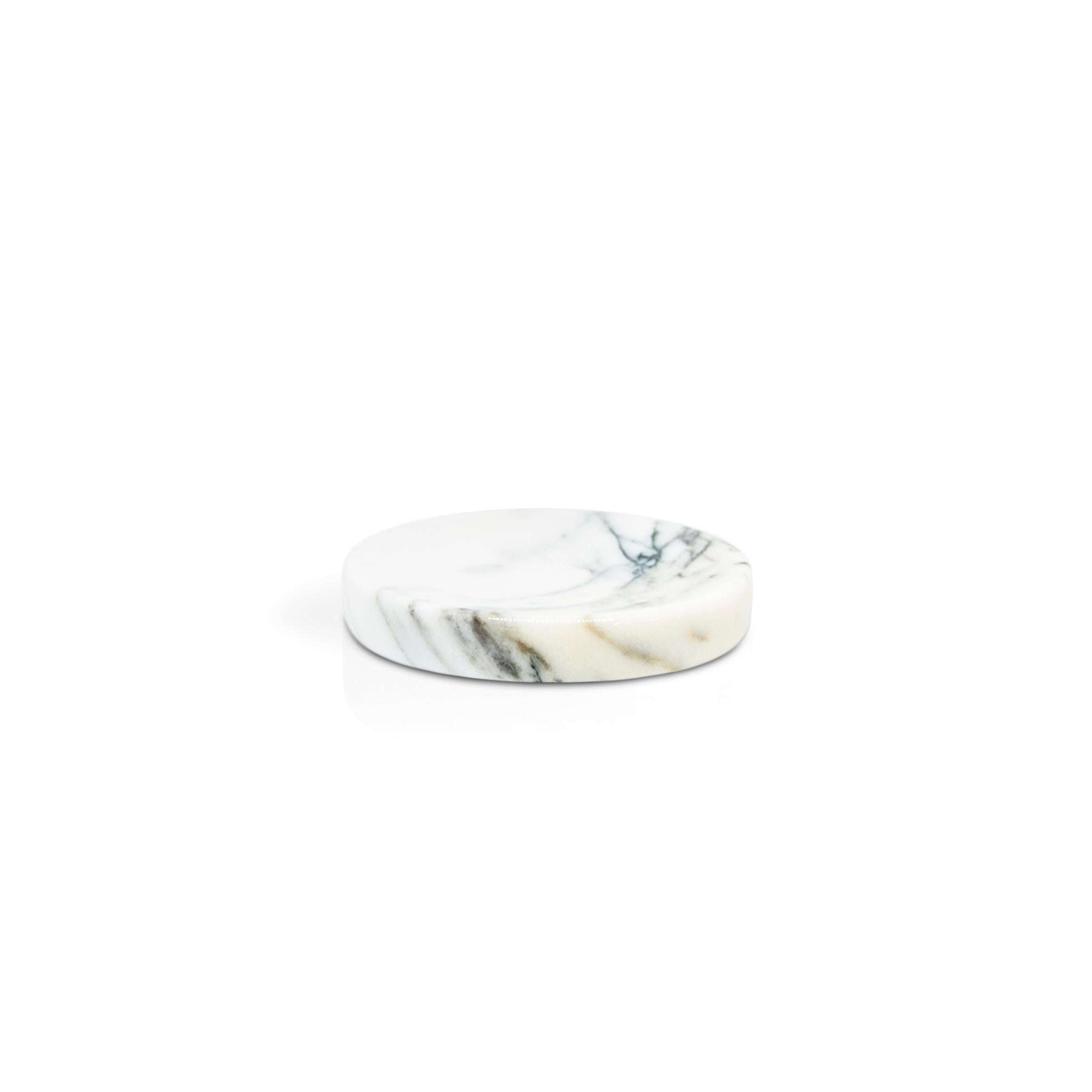 Rounded soap dish in Paonazzo marble.

Each piece is in a way unique (since each marble block is different in veins and shades) and handcrafted in Italy. Slight variations in shape, color and size are to be considered a guarantee of an handcrafted