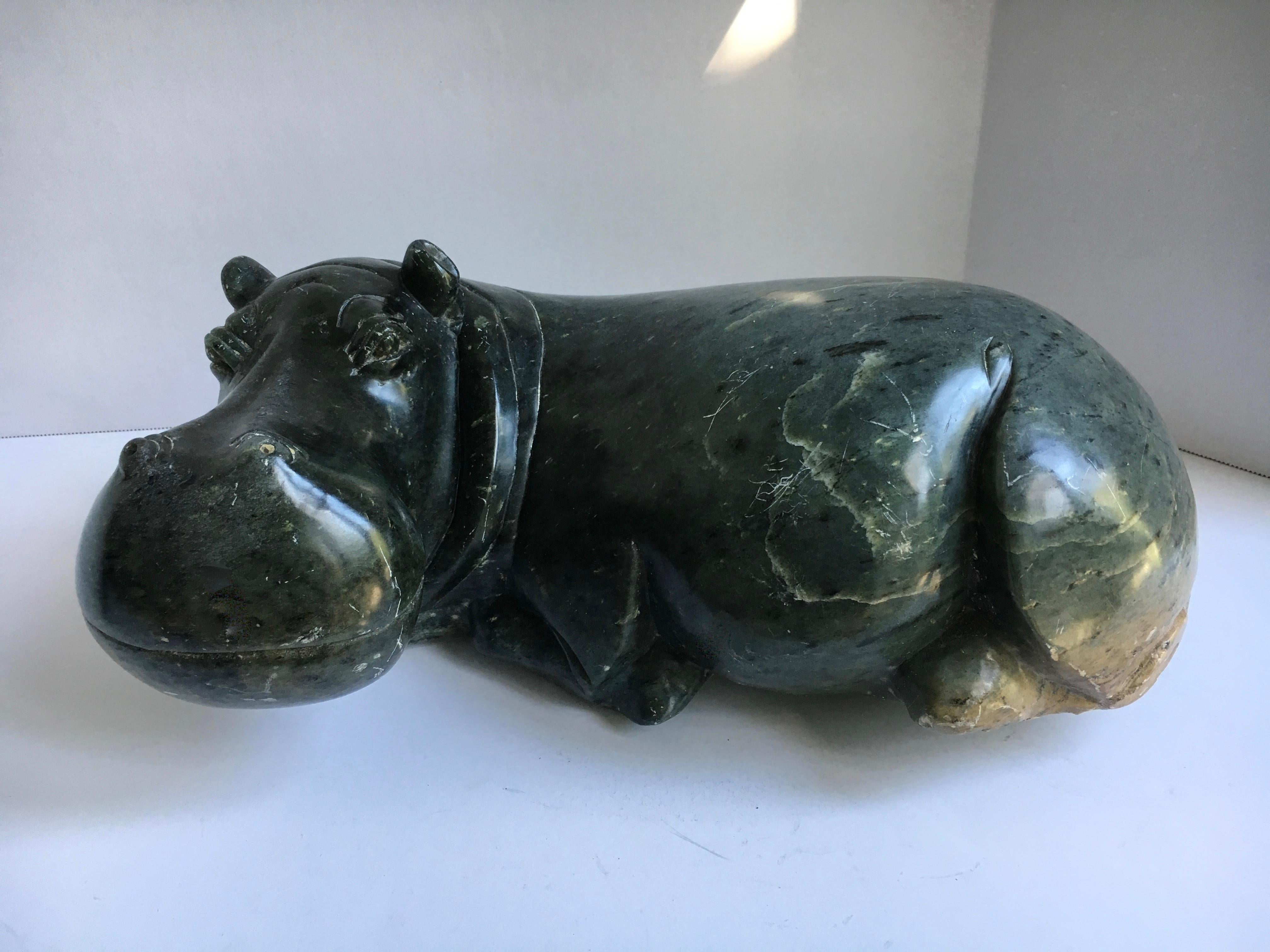 A very handsome carved sculpture of. Hippo made from Soapstone or Jadeite. The very large and heavy piece is a wonderful representation and ready for any shelf or living space.