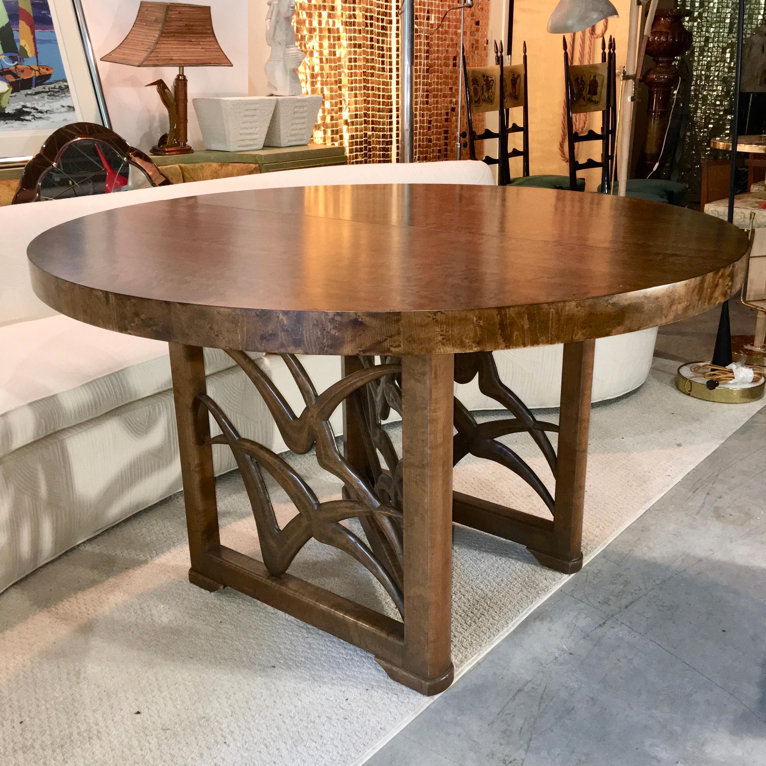 Italian American modernist design expandable round dining table by Adolfo Genovese of F. & G. Handmade Furniture Co. 121 First Street East Cambridge, MA.
This table was made late 1940s-early 1950s.
The base is a walnut N- or Z- form frame of three