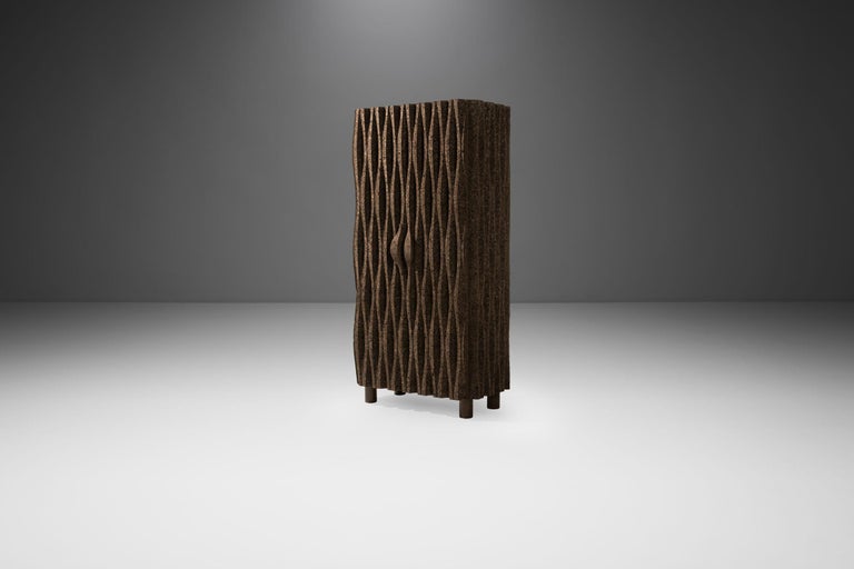 Part of the limited edition Sobreiro Collection, this “Wave Cabinet” is perhaps the most recognisable of the cork cabinets in the exclusive collection by the Campana Brothers.

The wave-shaped front is masterfully crafted from the unique cork