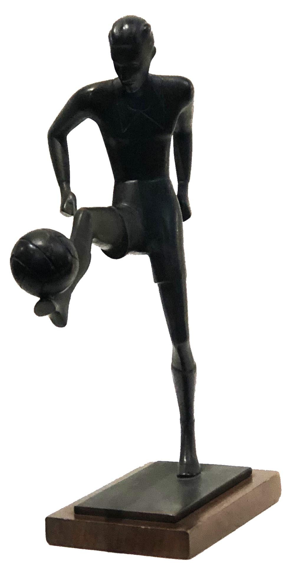 Art Deco
Soccer Player
Patinated Bronze Sculpture
Germany, ca. 1930’s

DIMENSIONS
Height: 9.5 inches            Width: 6.75 inches            Depth: 2.75 inches

ABOUT
A rare, laconic, dynamic and expressive collectible tabletop sculpture. The tense