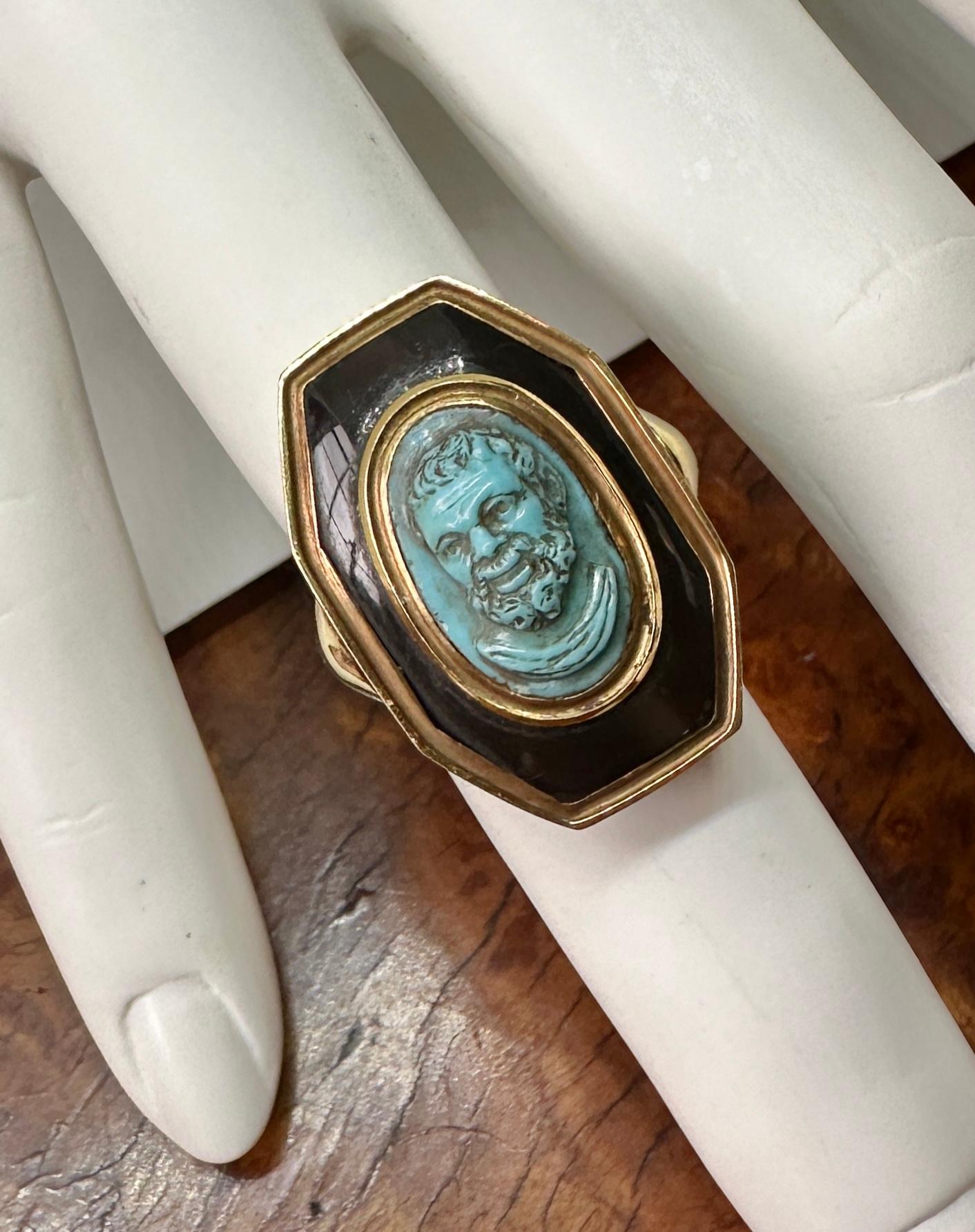 Indulge in a Museum Quality Turquoise Cameo Ring depicting Socrates in 18 Karat Yellow Gold and Black Onyx.  The Antique 19th Century Victorian Carved Cameo of Socrates in Turquoise is an absolute masterpiece of Cameo carving.  The extraordinary