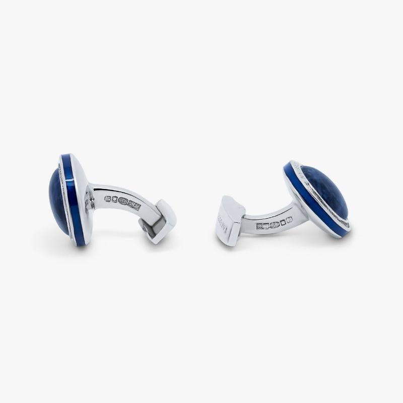 Sodalite Signature Round Cufflinks in Sterling Silver

Smooth sodalite domes sit within our round, rhodium plated sterling silver frame, with an engraved diamond pattern and blue-coloured enamel edge to accentuate the beauty of each semi-precious