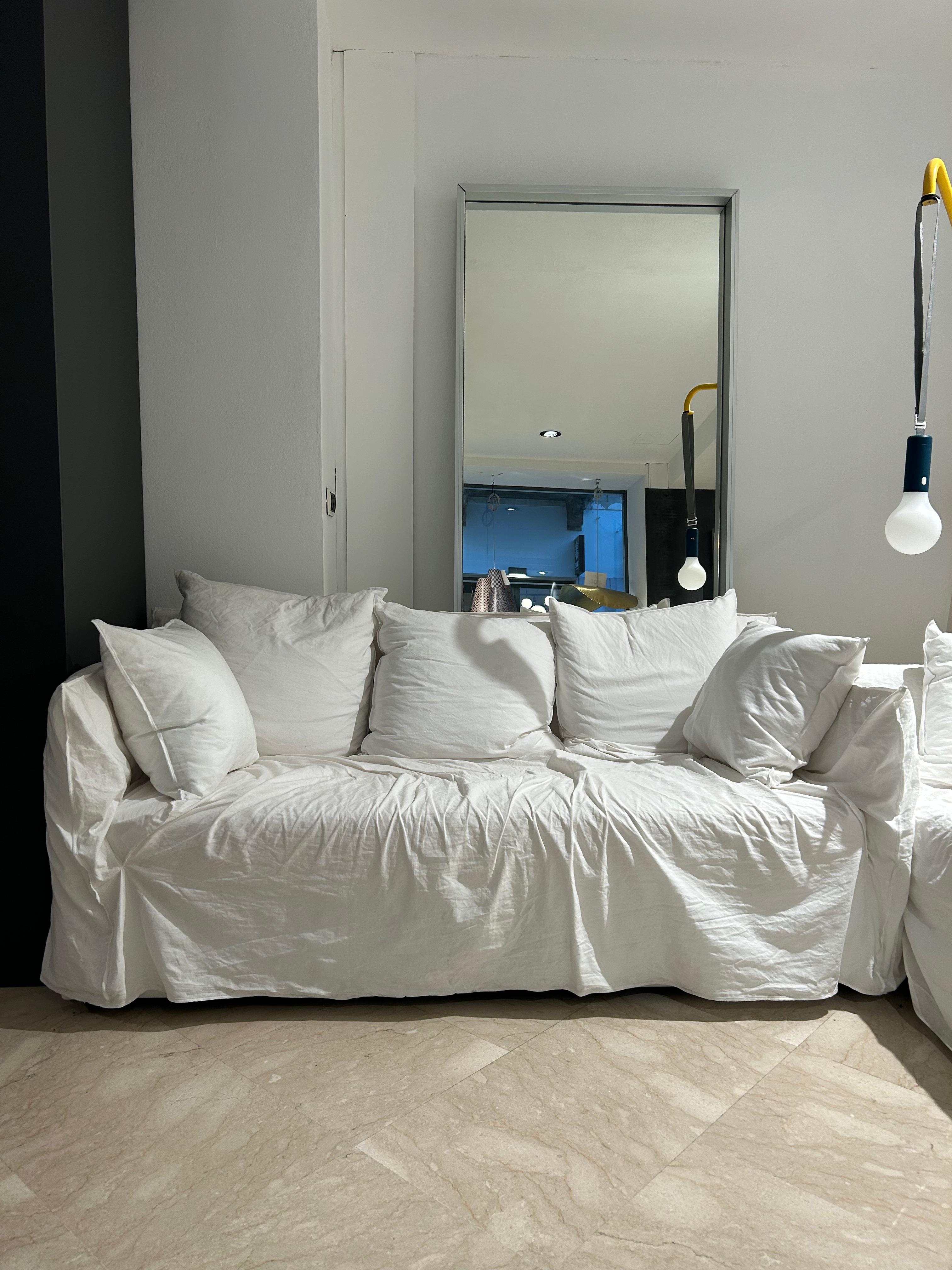The Ghost 10G sofa by Gervasoni, designed by Paola Navone, is a refined expression of contemporary comfort and textile versatility. Built around a light, minimal frame padded with high-quality polyurethane foam, it offers generous, loose cushions in