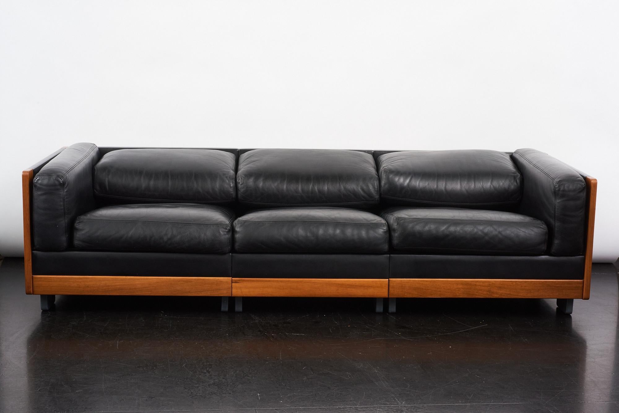 Extremely simple lined 920 walnut and leather sofa designed by Afra and Tobia Scarpa for Cassina, Italy 1964. In 1963, Afra and Tobia Scarpa started their collaboration with the Italian manufacturer Figli di Amedeo Cassina, designing an iconic
