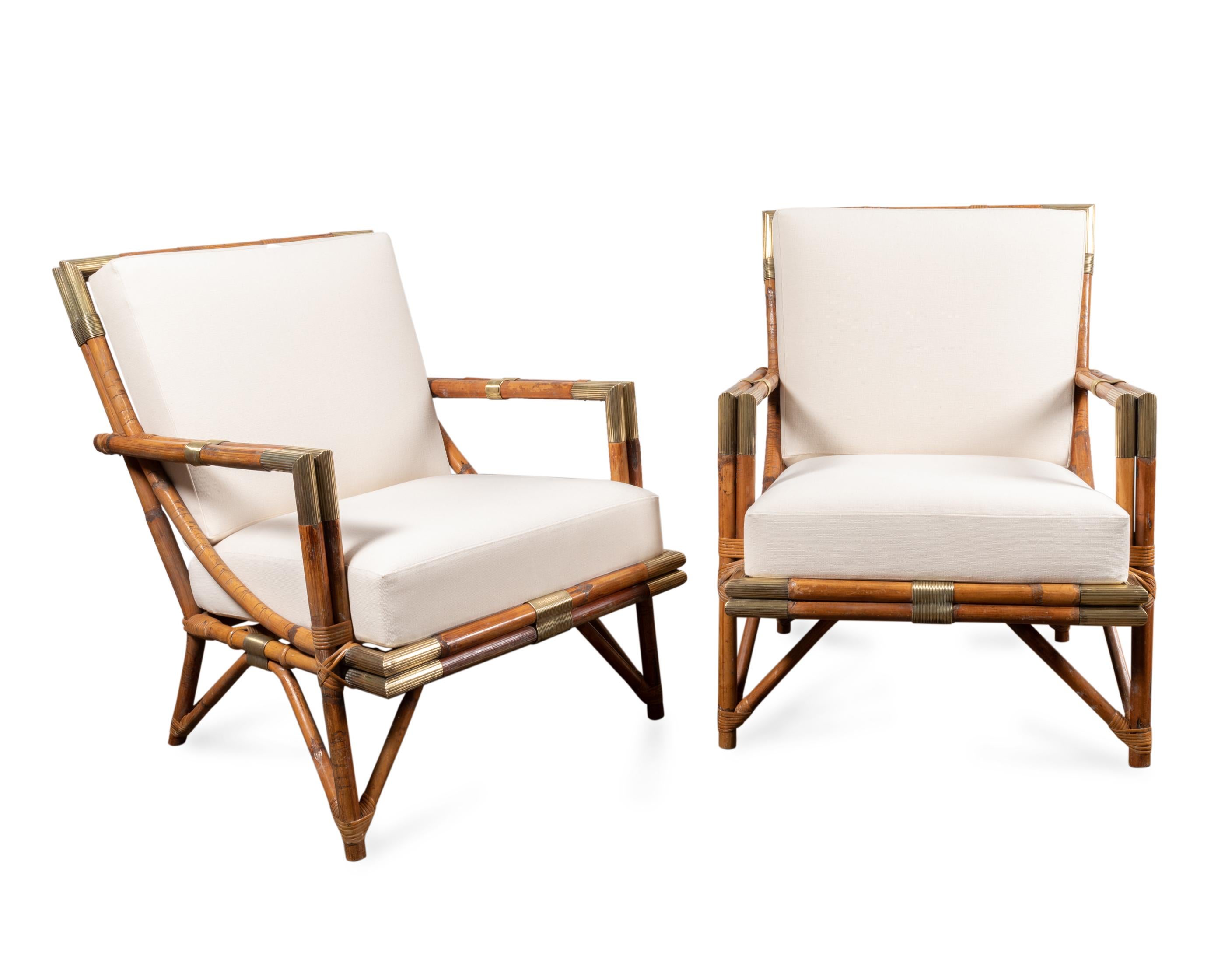 Sofa and lounge chairs set in rattan of Malaca and brass 
One 3-seat sofa and a pair of lounge chairs.
Two removable cushions. newly re upholstered in ecru cotton.
Design: Gilles Sermadiras and Jean Dive for Maison et Jardin, 1955,
France, circa