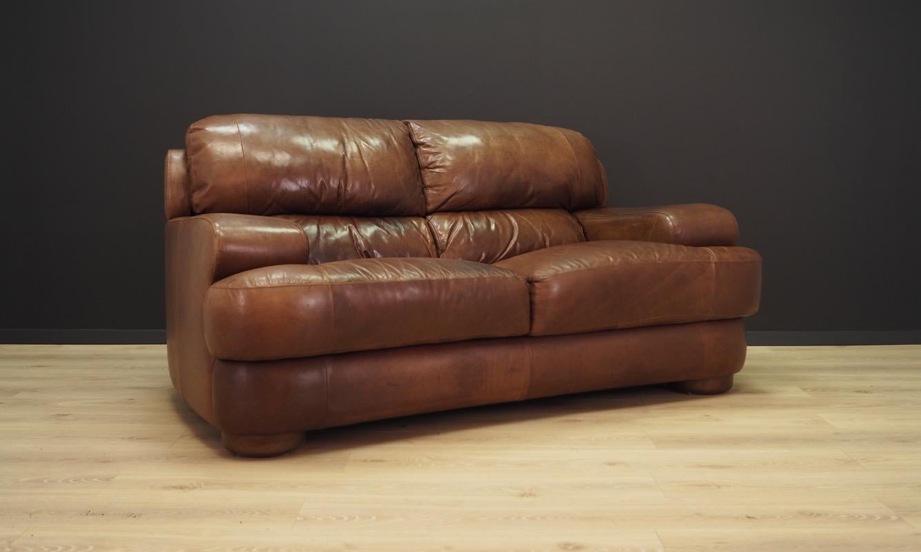 Scandinavian, leather, very comfortable sofa from the 1960s-1970s, Danish design, Minimalist form. Original leather upholstery in brown. Maintained in good condition (minor abrasions, cracks and spots on the leather), directly for