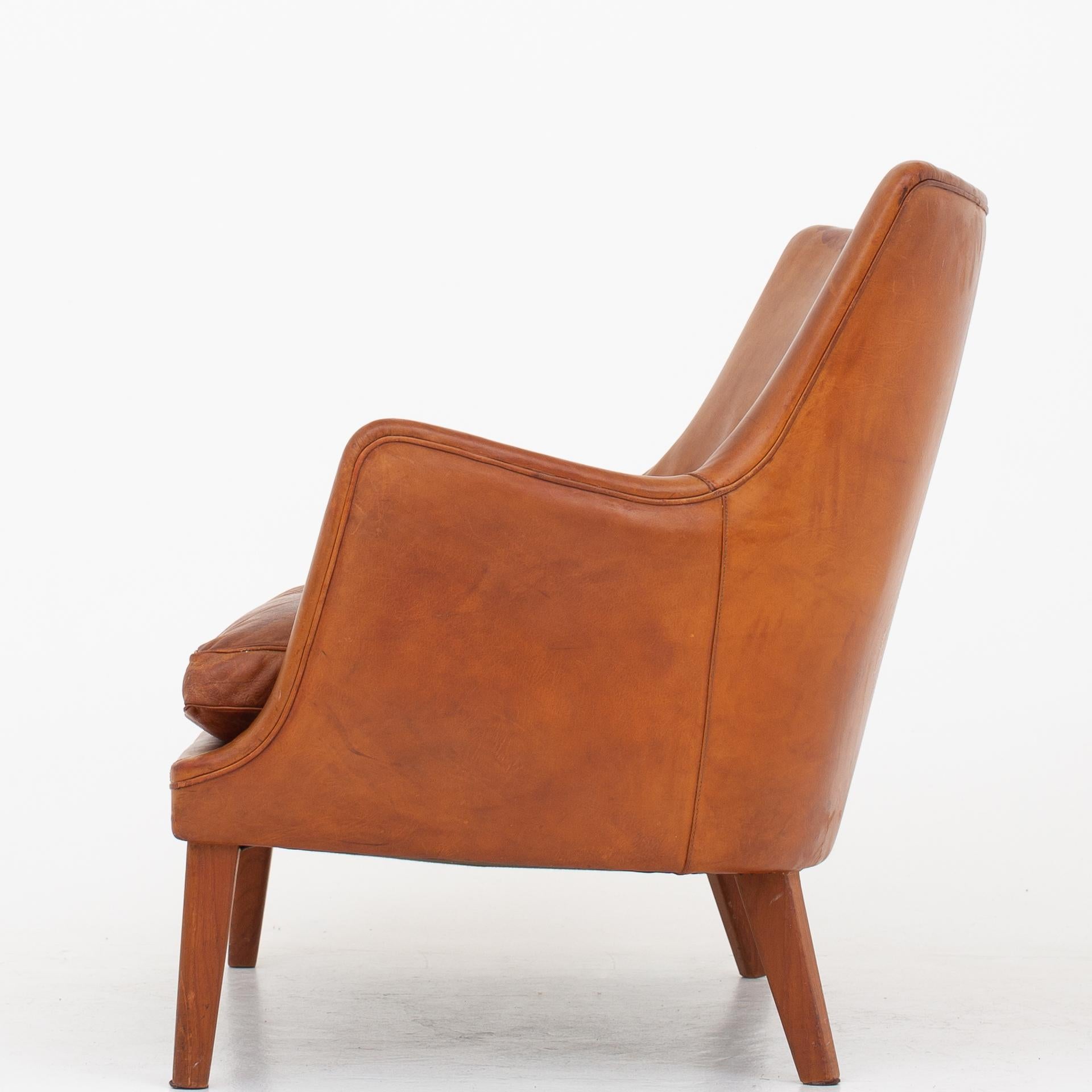 AV 53/2 - Sofa in patinated natural leather with legs in teak. Maker Ivan Schlechter.