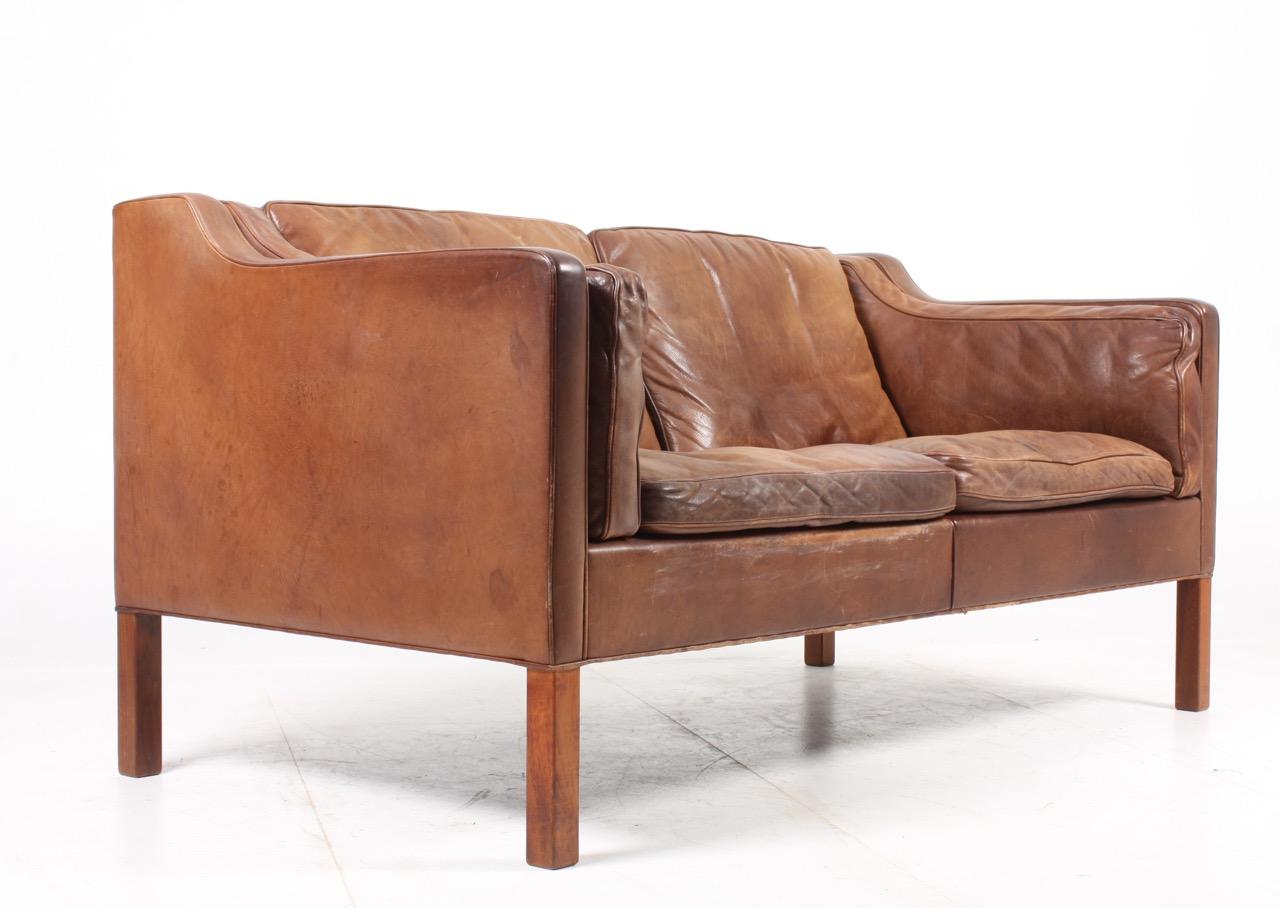 Sofa model 2212 in patinated leather designed by MAA. Børge Mogensen for Fredericia Møbelfabrik in 1962. The sofa was designed as an input for Mogensen’s own home only but is today the most iconic Danish design sofa of all times. Out standing