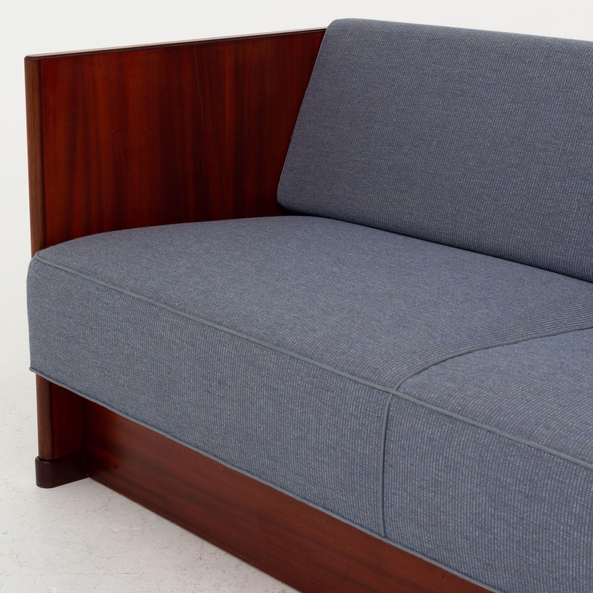 Sofa bed in mahogany w. blue cushions. Frits Henningsen.