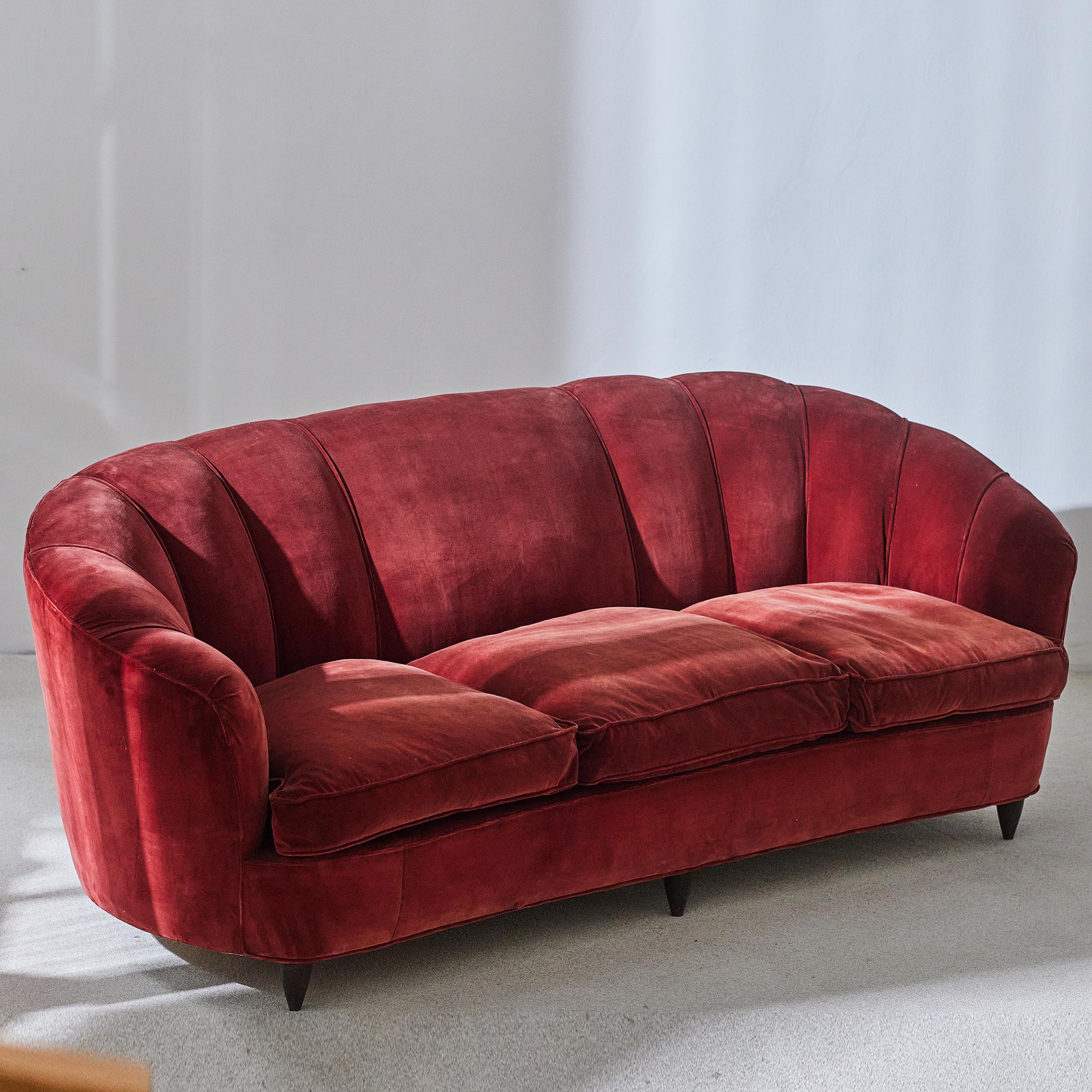 A rare sofa by Gio Ponti for Casa e Giardino, 1936. This shell model is covered in the original velvet of the era and features goose down cushions for luxurious comfort. As seen in the photos, the upholstery has faded and shows wear in certain