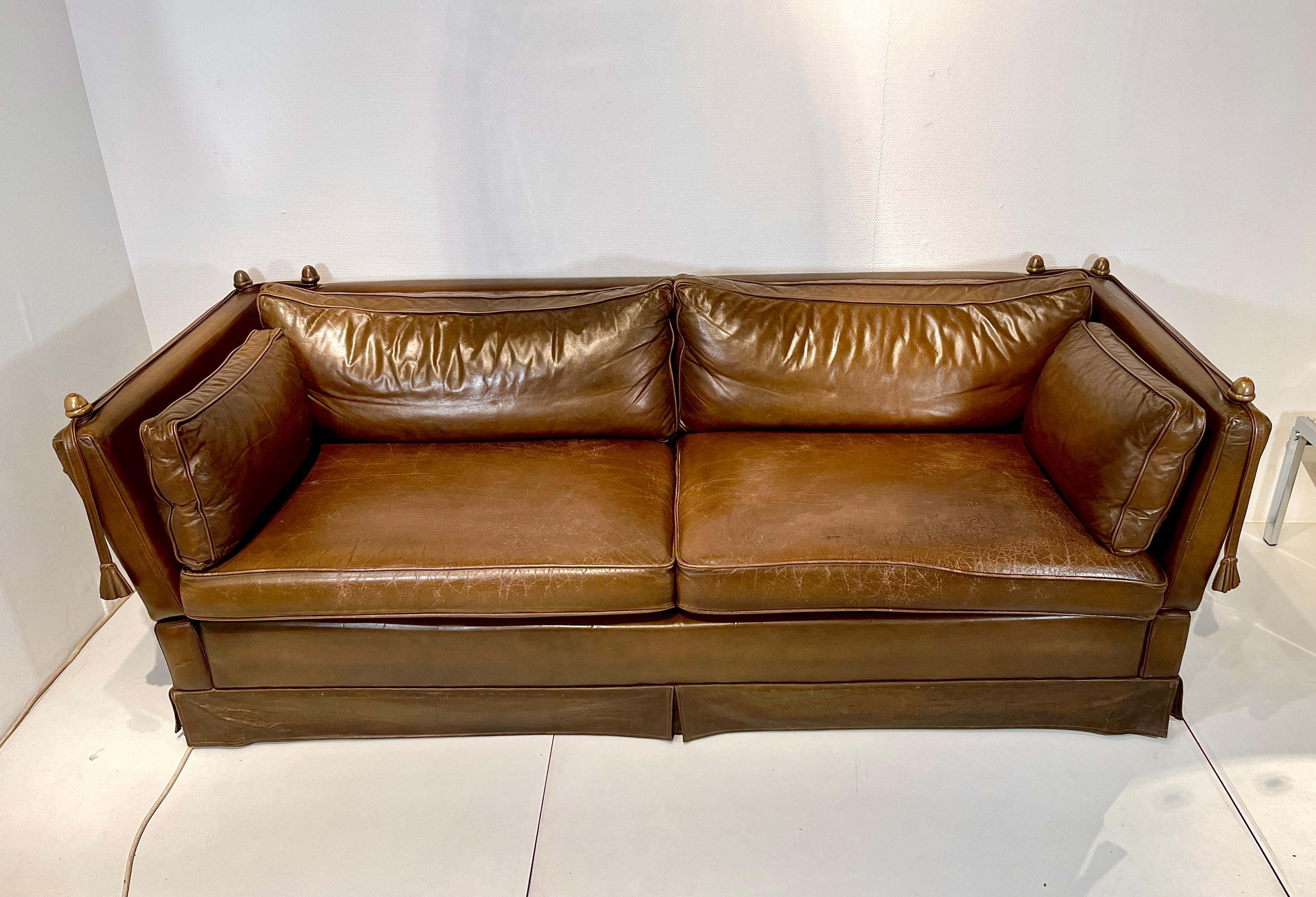 Original vintage sofa By Maison Jansen circa 1960 in good condition.

It concerns the very rare 3 seat in brown cognac leather.
 