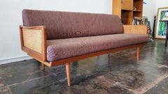 Sofá de Peter Hvidt y Orla Mølgaard-Nielsen para John Stuart Paneles de caña tejidos