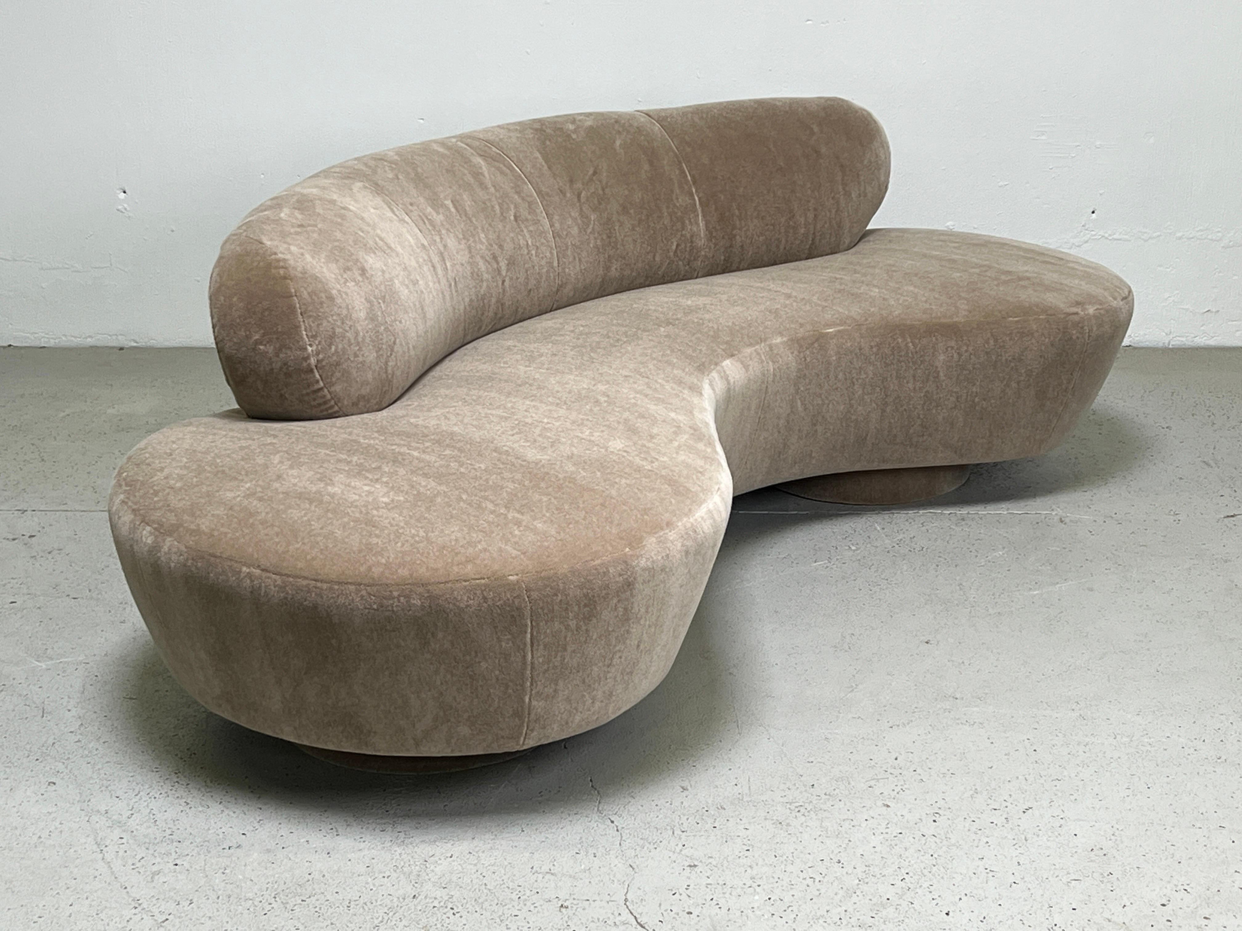 A serpentine / cloud sofa designed by Vladimir Kagan for Directional. Fully restored and upholstered in Holly Hunt / Fuzzy Wuzzy / Honey Bear plush mohair. Matching pair available. 