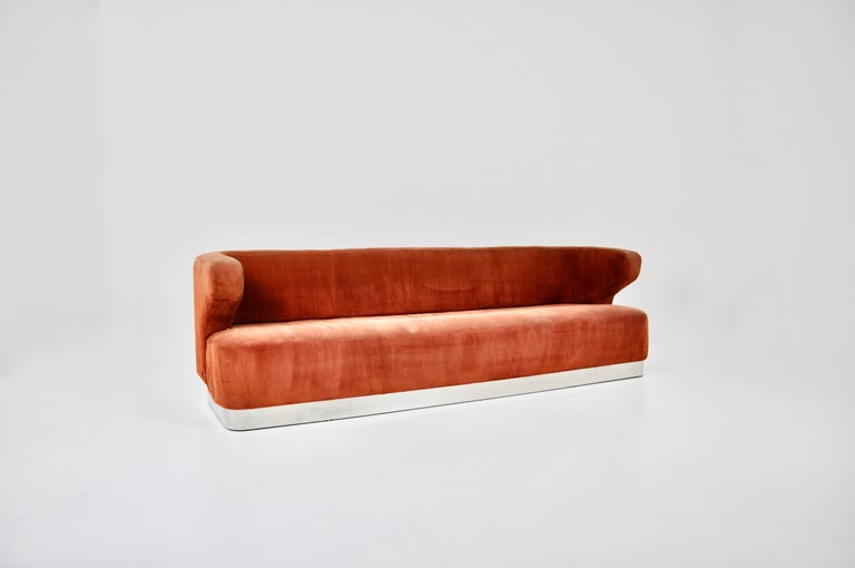 Orange sofa in fabric with chromed metal leg. Seat height: 38 cm. Wear due to time and age of the sofa.
 