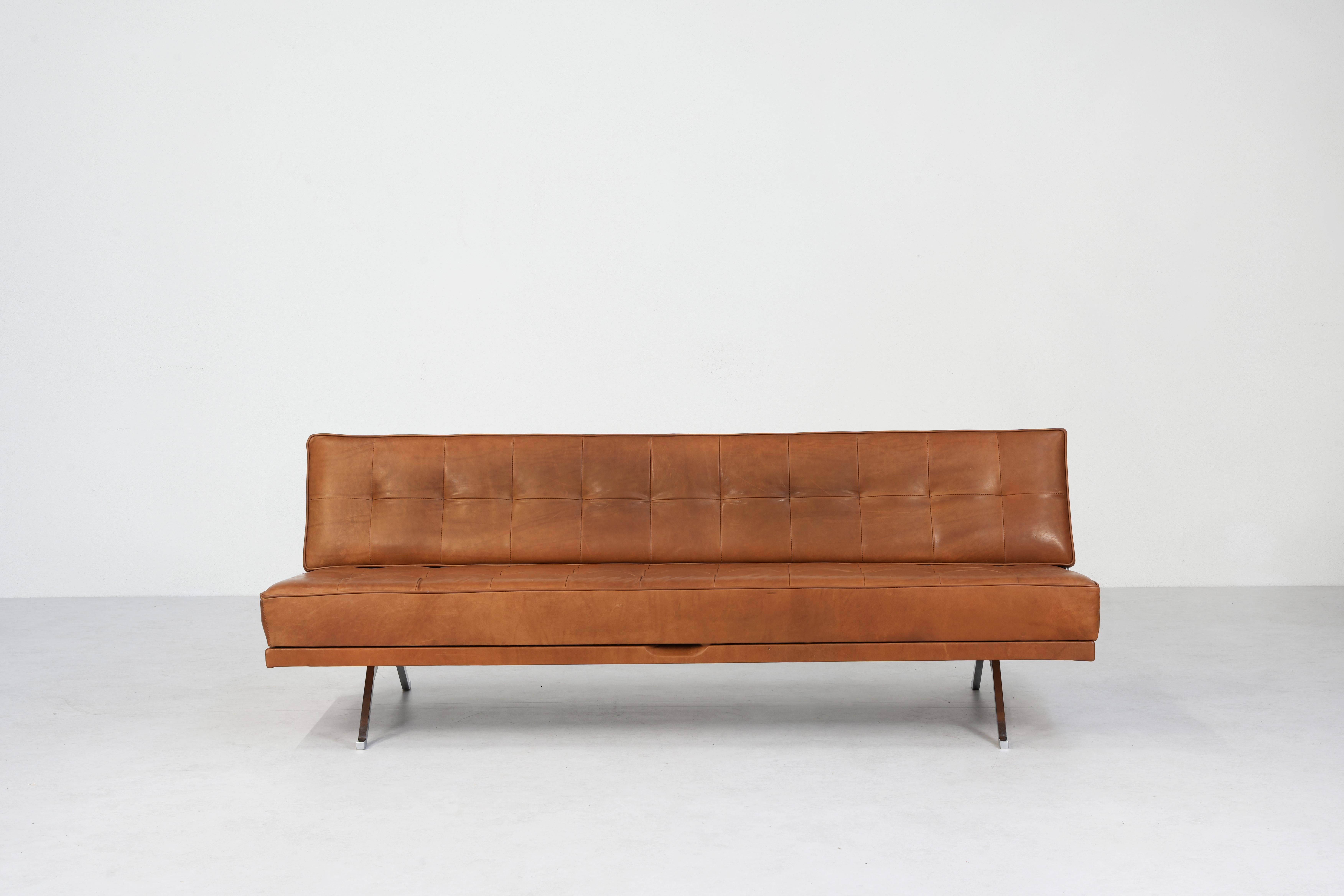 Beautiful Sofa Daybed Mod. Constanze Designed by Johannes Spalt for Wittmann, Austria 1960ies.
An elegant construction, that can be converted from a sofa into a bed with one hand and in seconds. 
The sofa comes in brown cognac leather and is in
