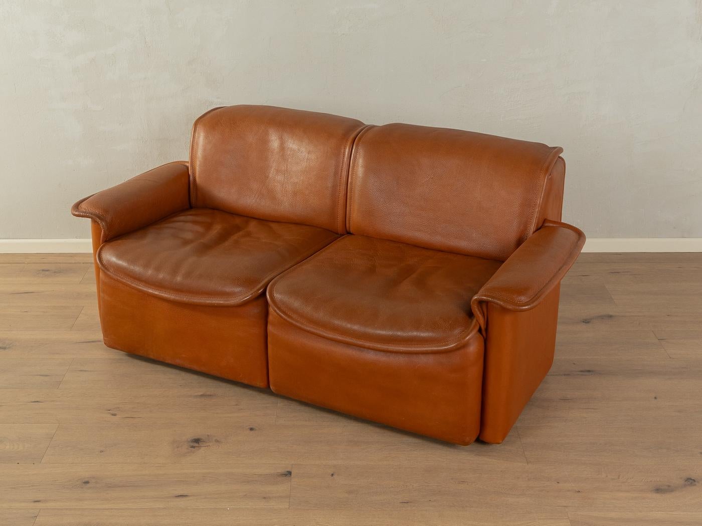 Classic sofa from the 1970s. Model DS-12 by de Sede with the striking original cover made of cognac-colored buffalo leather with a beautiful patina and coarse stitching.

Quality Features:

    very good workmanship
    high-quality materials
   