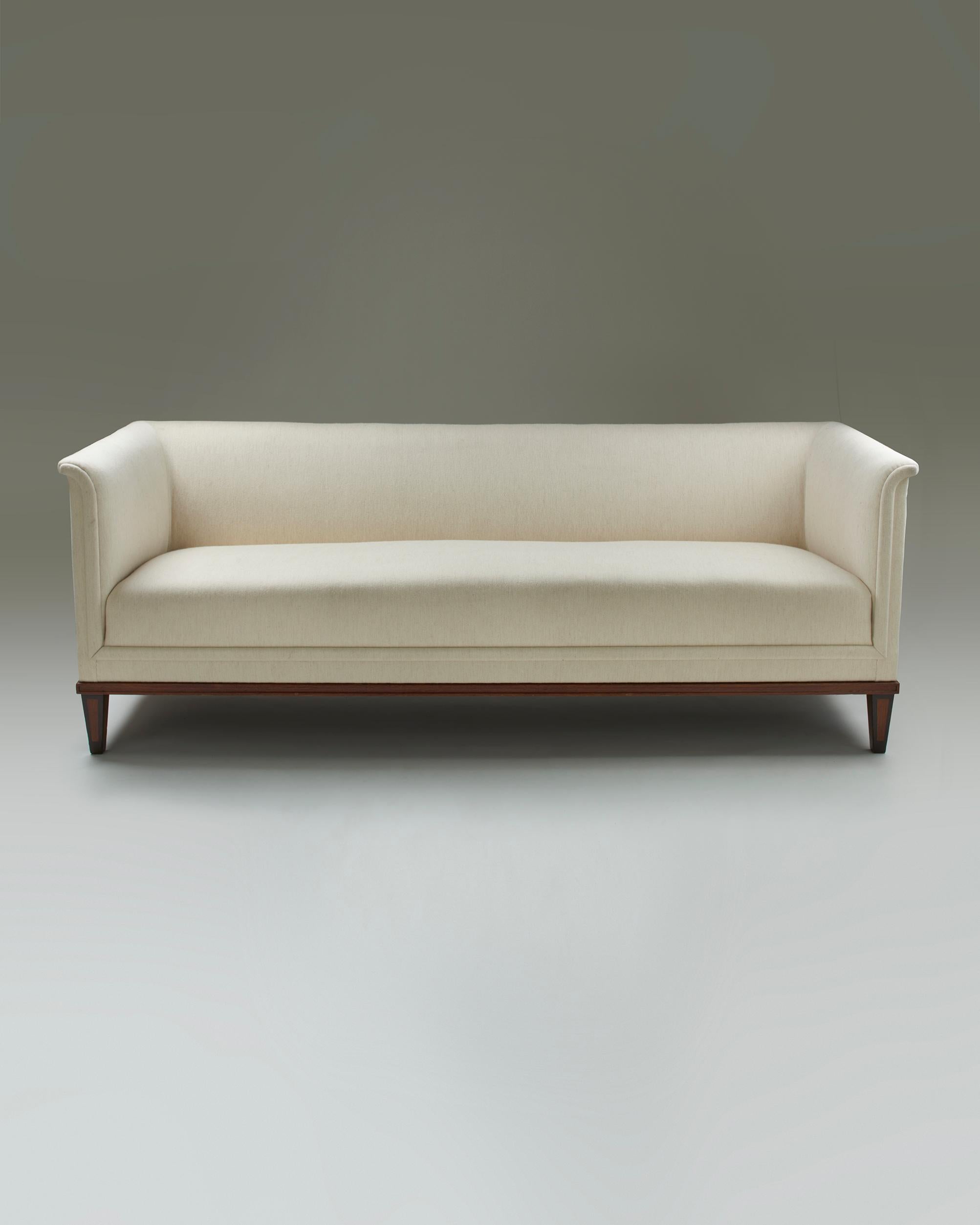 Sofa designed by Birger Hahl for A. Salmi Huonekalutehdas, Finland. 1931.

Oak, wool upholstery.

Commissioned for the Parliament House, Helsinki, 1931.

Stamped “A. SALMI HUONEKALUTEHDAS”

H: 75 cm/ 2' 5 1/2