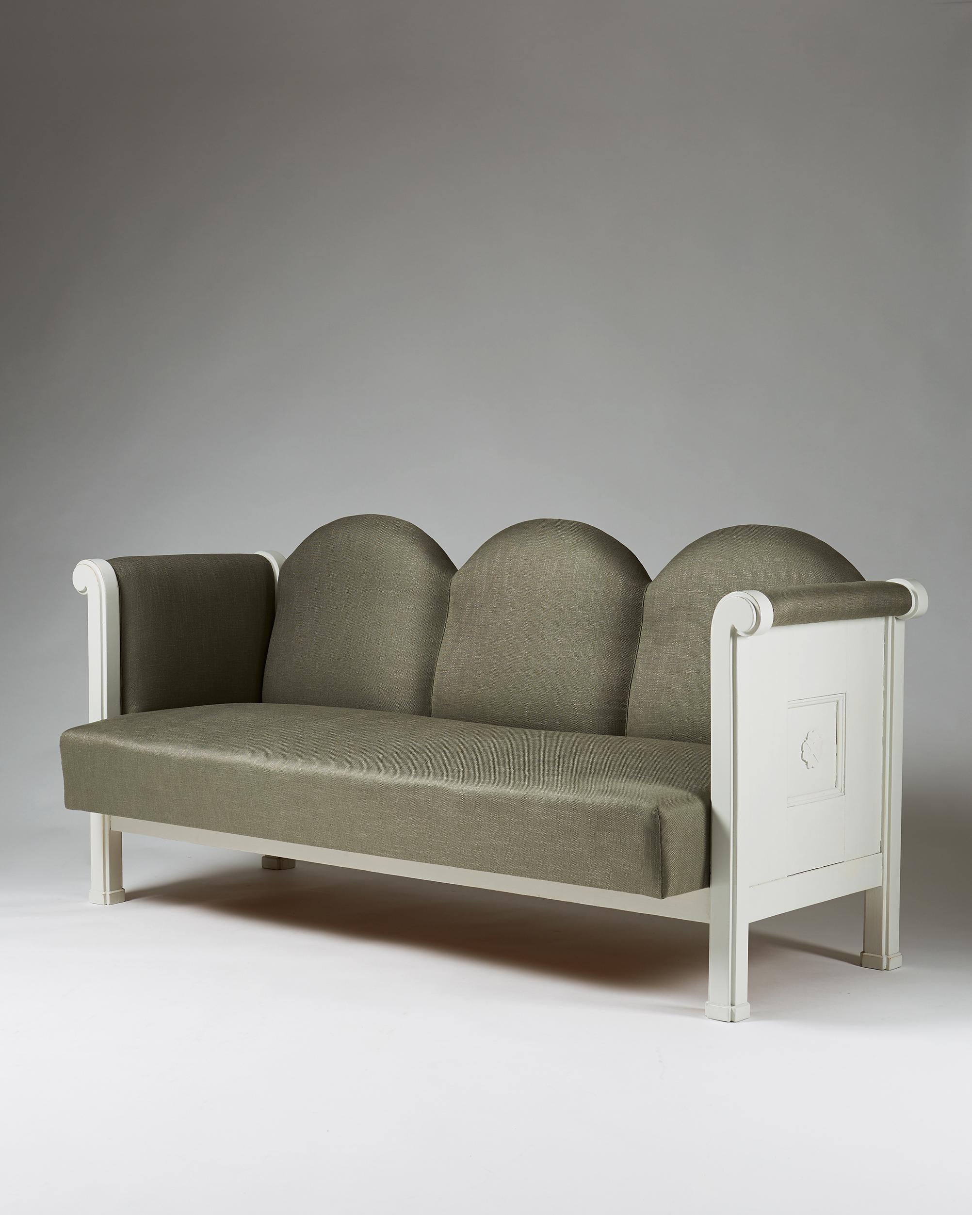 White painted wood, newly upholstered in linen fabric.

Measures: L 195 cm/ 6' 5 1/4''
H 86 cm/ 2' 10''
D 88 cm/ 2' 11''

Custom order from Eliel Saarinen to Munksnäs hotel, Finland.
These models only produced for the hotel.