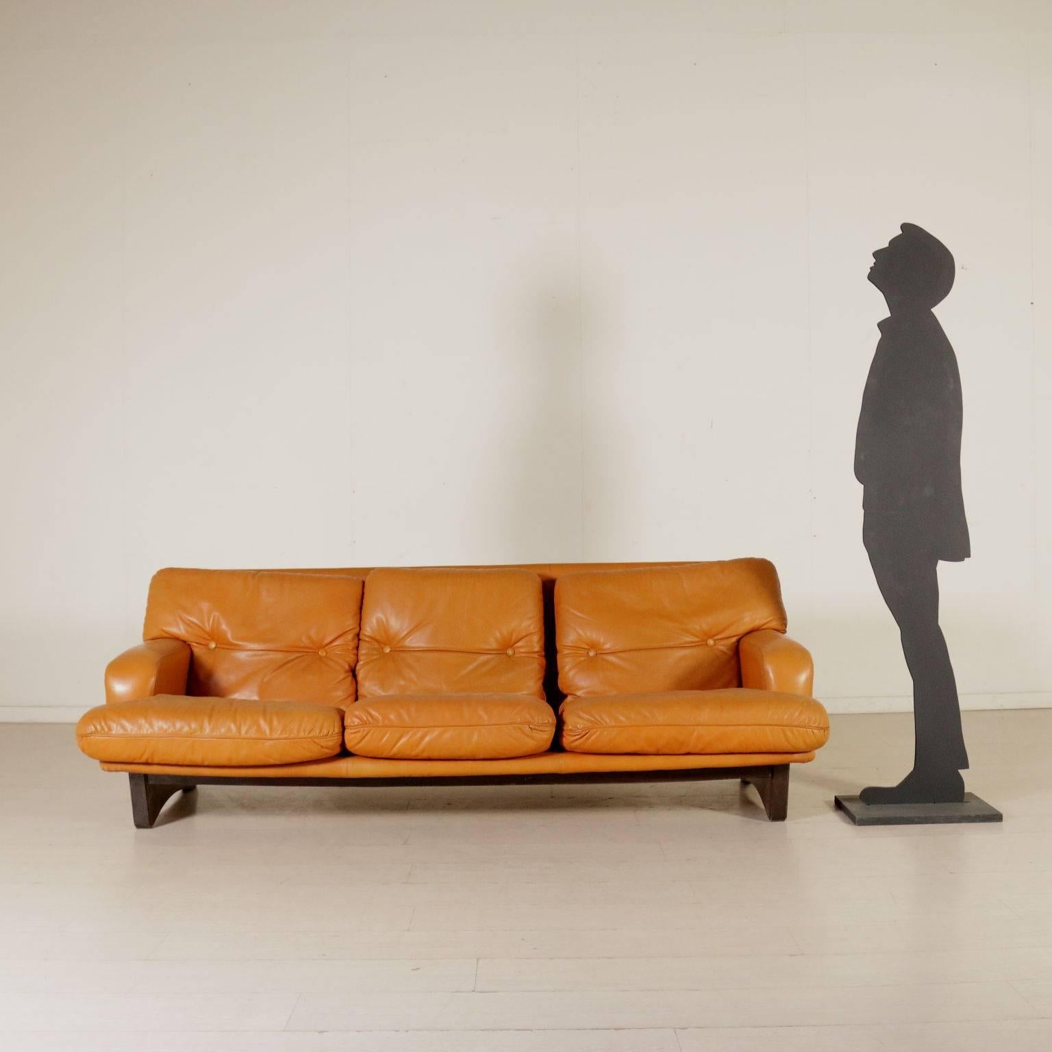 A sofa, foam padding, leather upholstery and wood legs. Manufactured in Italy, 1960s.