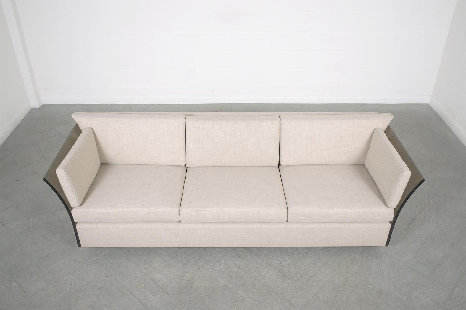 Discover the extraordinary charm of this 1960s Milo Baughman sofa. Immaculately restored by our team of expert craftsmen, this solid wood and lucite combination sofa promises unparalleled comfort and style. It boasts three plush foam seats and back