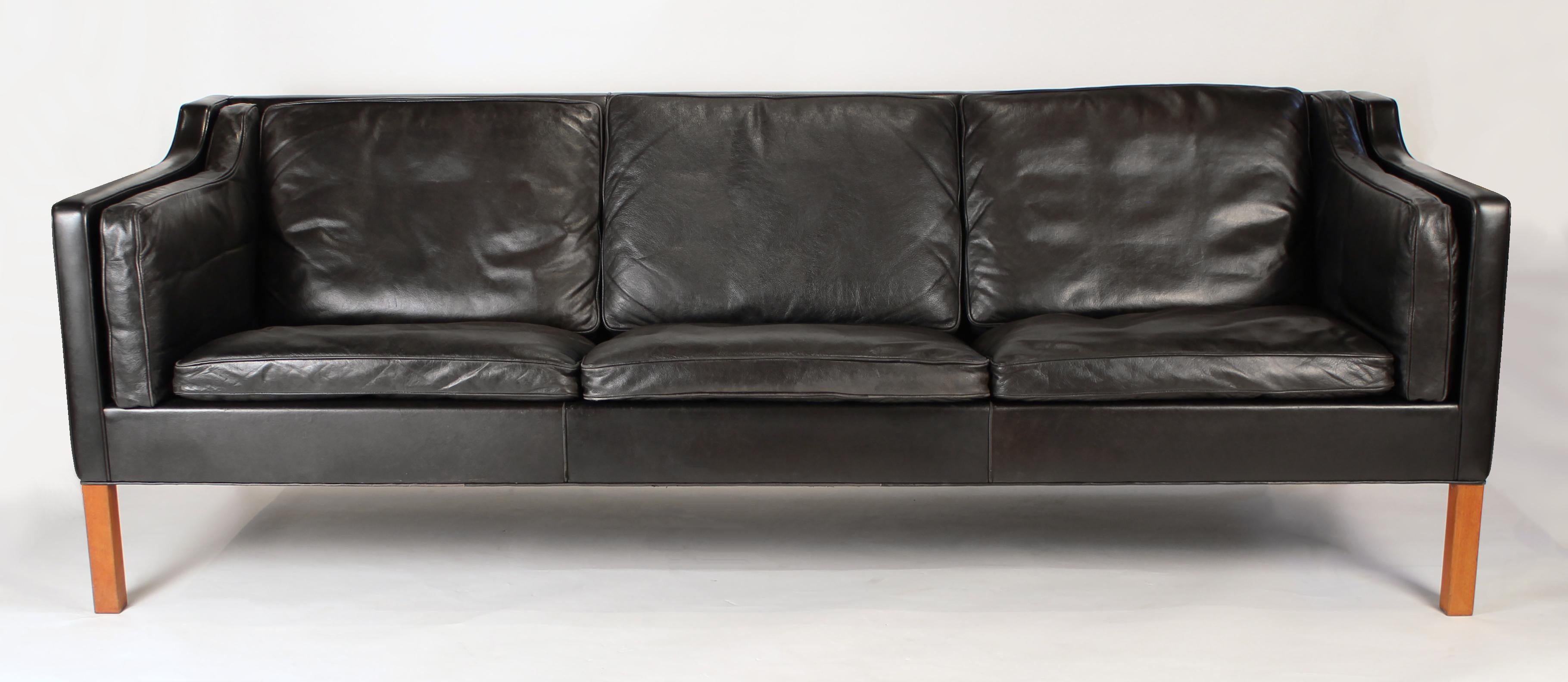 Sofa model 2213 in the original black leather designed by Borge Mogensen manufactured by Fredericia, Denmark, 1962. The sofa is in very good original condition designed with six down fil cushions.