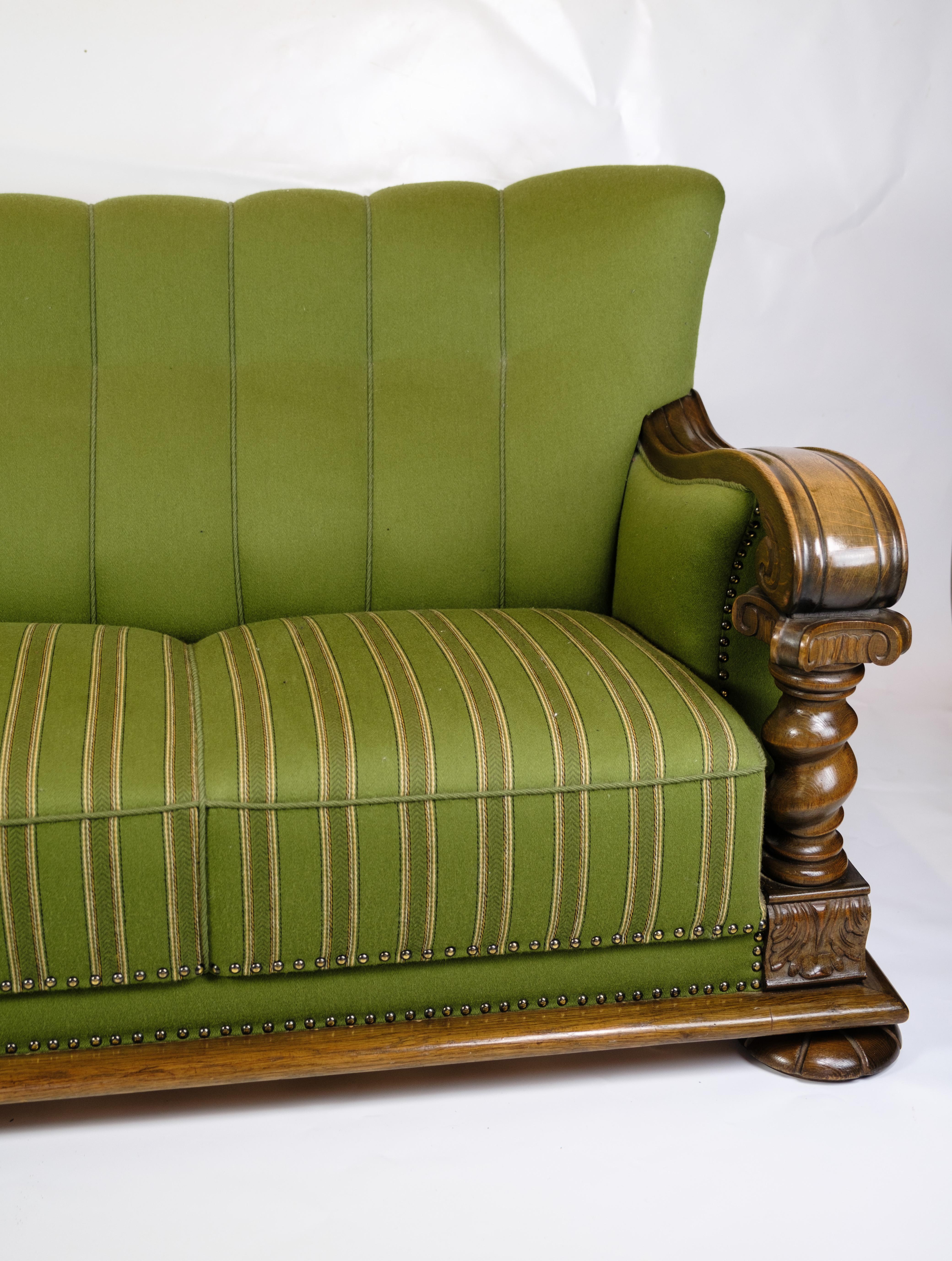 Transport Yourself to Renaissance Opulence: 1920s Sofa in Luxurious Green Upholstery

Indulge in the grandeur of the Renaissance era with this exquisite sofa, a testament to timeless elegance and meticulous craftsmanship.

Crafted around the 1920s,