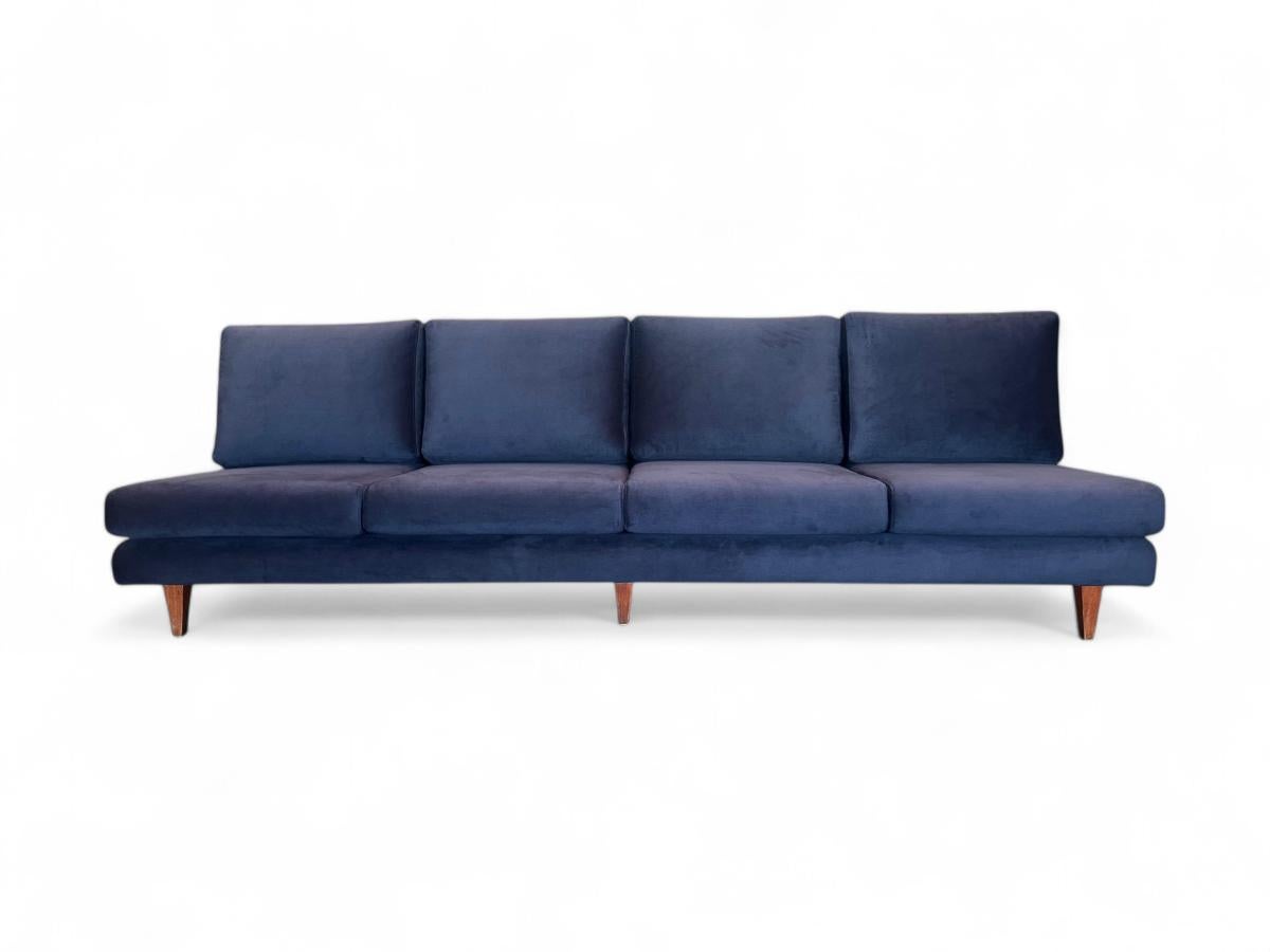 This one-of-a-kind four seat sofa with no arms was designed by Joaquim Tenreiro and manufactured by Tenreiro Moveis e Decoraçoes in the late 1950s or early 1960s. The sofa features a solid hardwood structure that has been completely reinforced. The