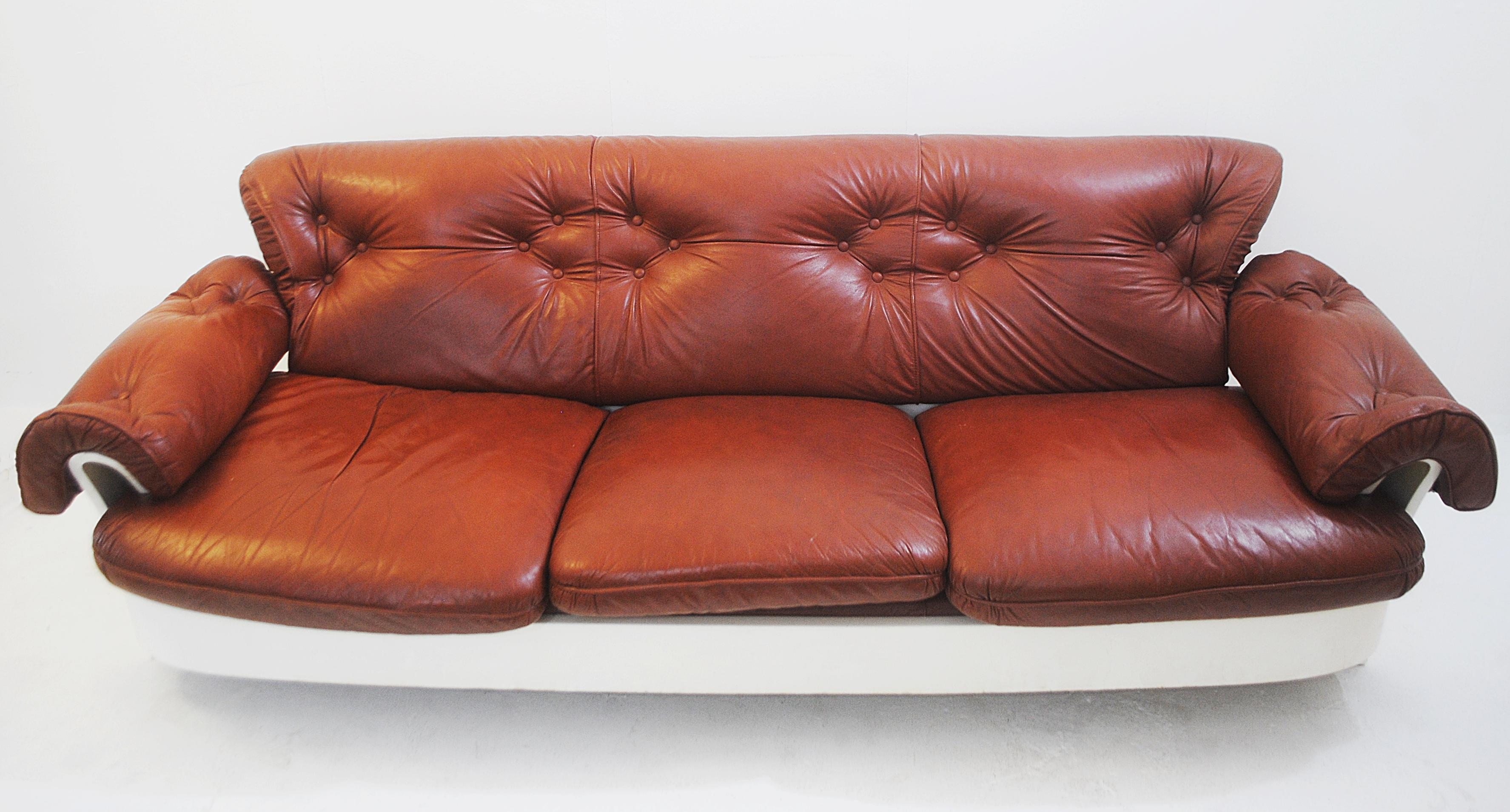 Sofa in leather and lacquered wood, Italy, circa 1980s.