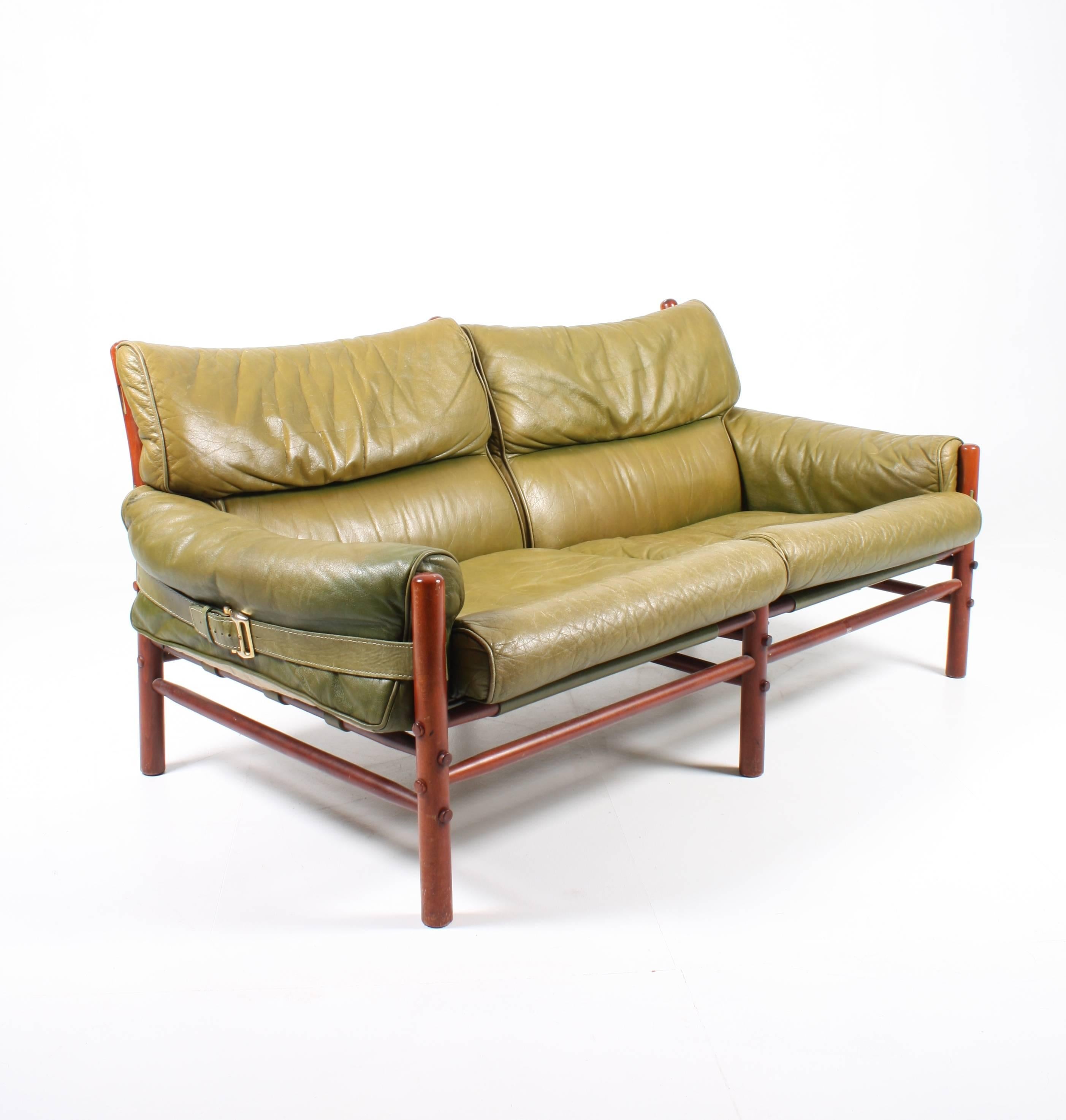 Sofa in patinated green leather and solid wood frame. designed by Arne Norell for Norell Møbel AB in the mid-1960s. A Very comfortable sofa in timeless design and quality. Made in Sweden.