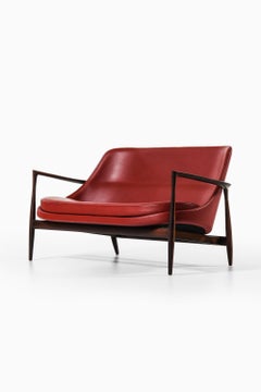 Sofa in Rosewood and Reupholstered in Burgundy Leather by Ib Kofod-Larsen, 1956