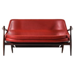 Vintage Sofa in Rosewood and Reupholstered in Burgundy Leather by Ib Kofod-Larsen, 1956