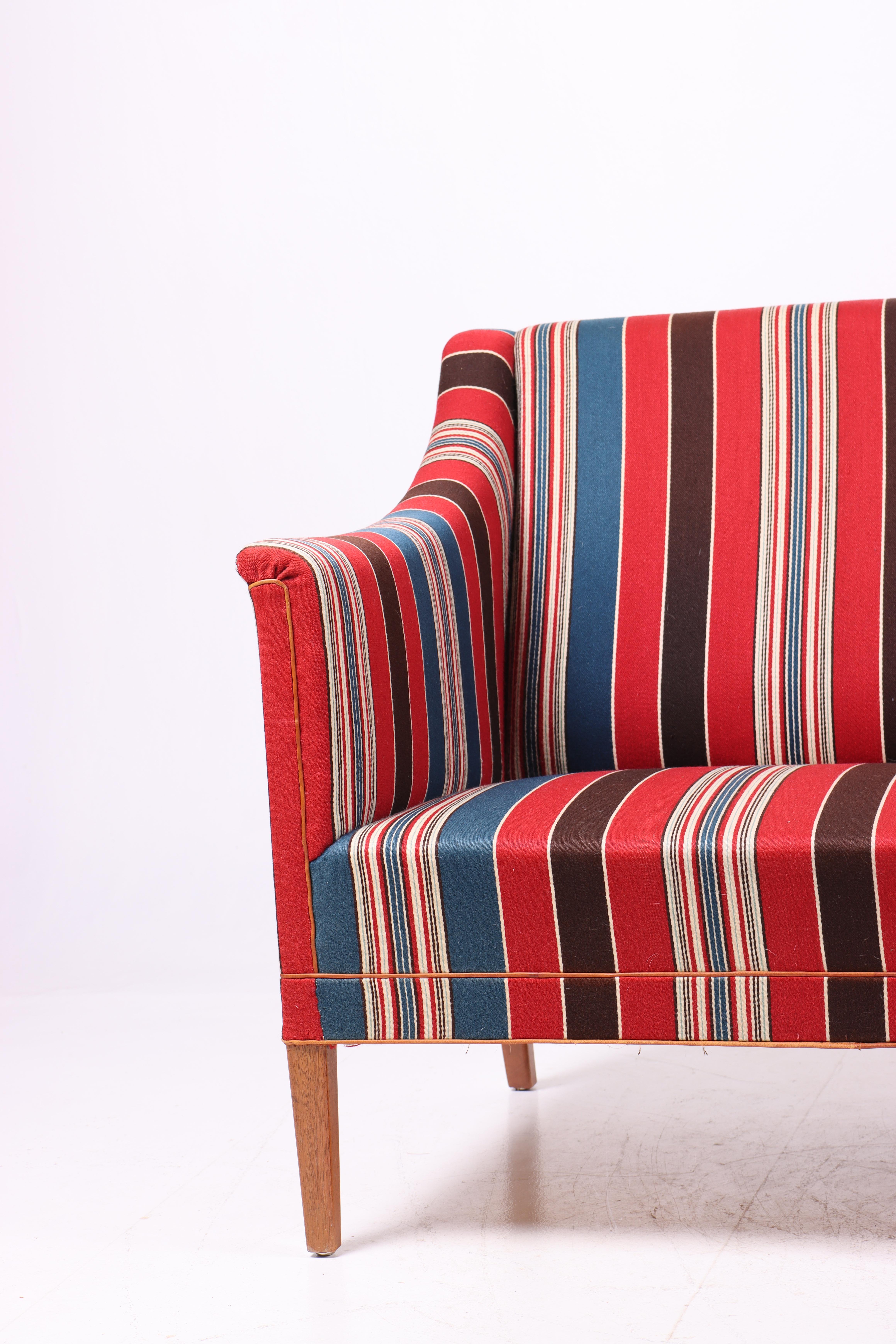 Stylish sofa upholstered in wool designed by MAA Kaare Klint for Rud Rasmussen cabinetmakers in 1940. Great original condition.