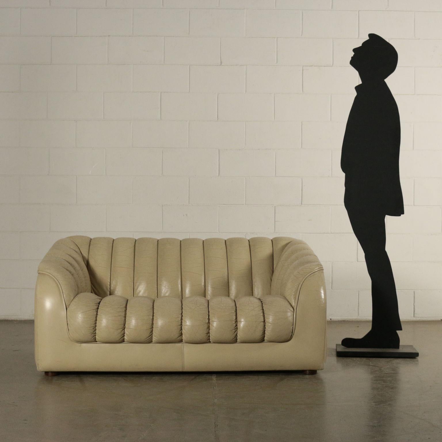 Two-seat sofa, foam padding, leatherette upholstery.