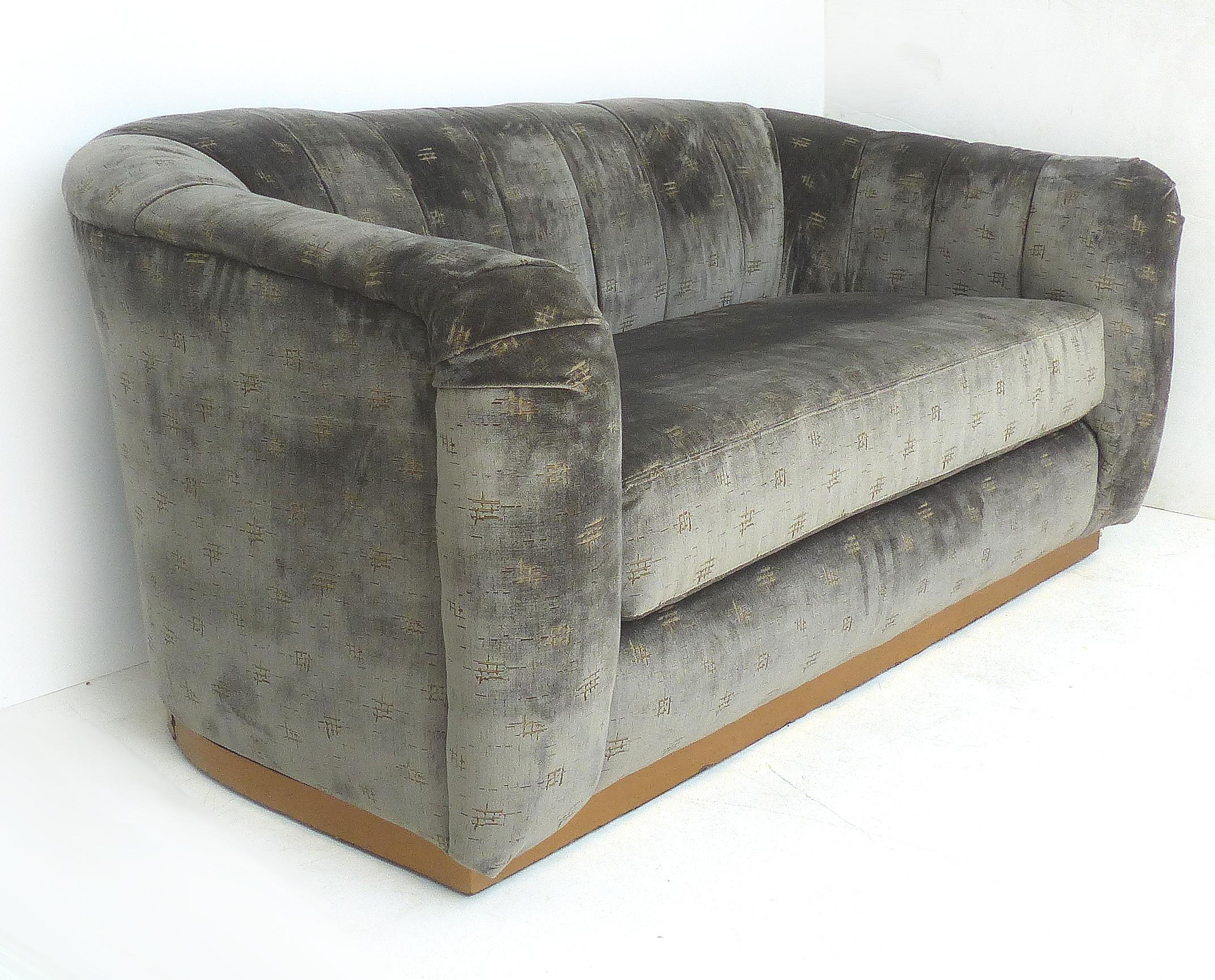 Sofa/Loveseat newly upholstered in Rubelli fabric, brass banded base

Offered for sale is a contemporary sofa that is newly upholstered with Italian Rubelli fabric in the Olimpia Tortora pattern. The sofa has a brass banded base. This would make
