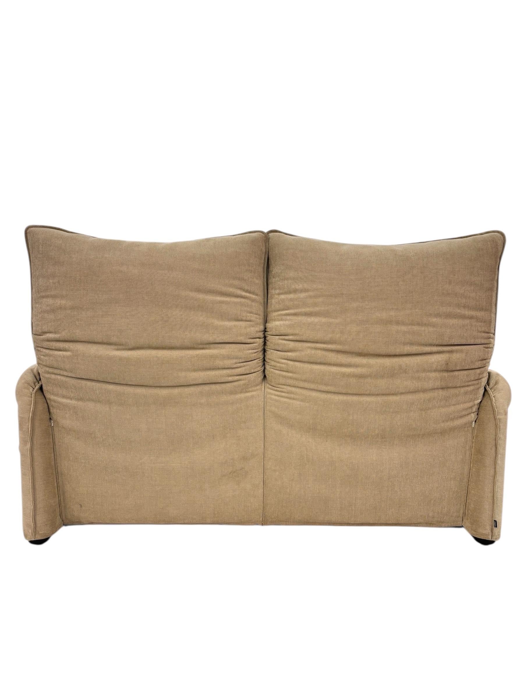 Modern Italian sofa designed by Vico Magistretti for Cassina, Circa 1970. 
This is a 2-seater sofa with independent folding headrests. The two armrests curve towards the seat. 
Cream/ Beige Velvet fabric in a very good condition.
Dimensions : 
- W :
