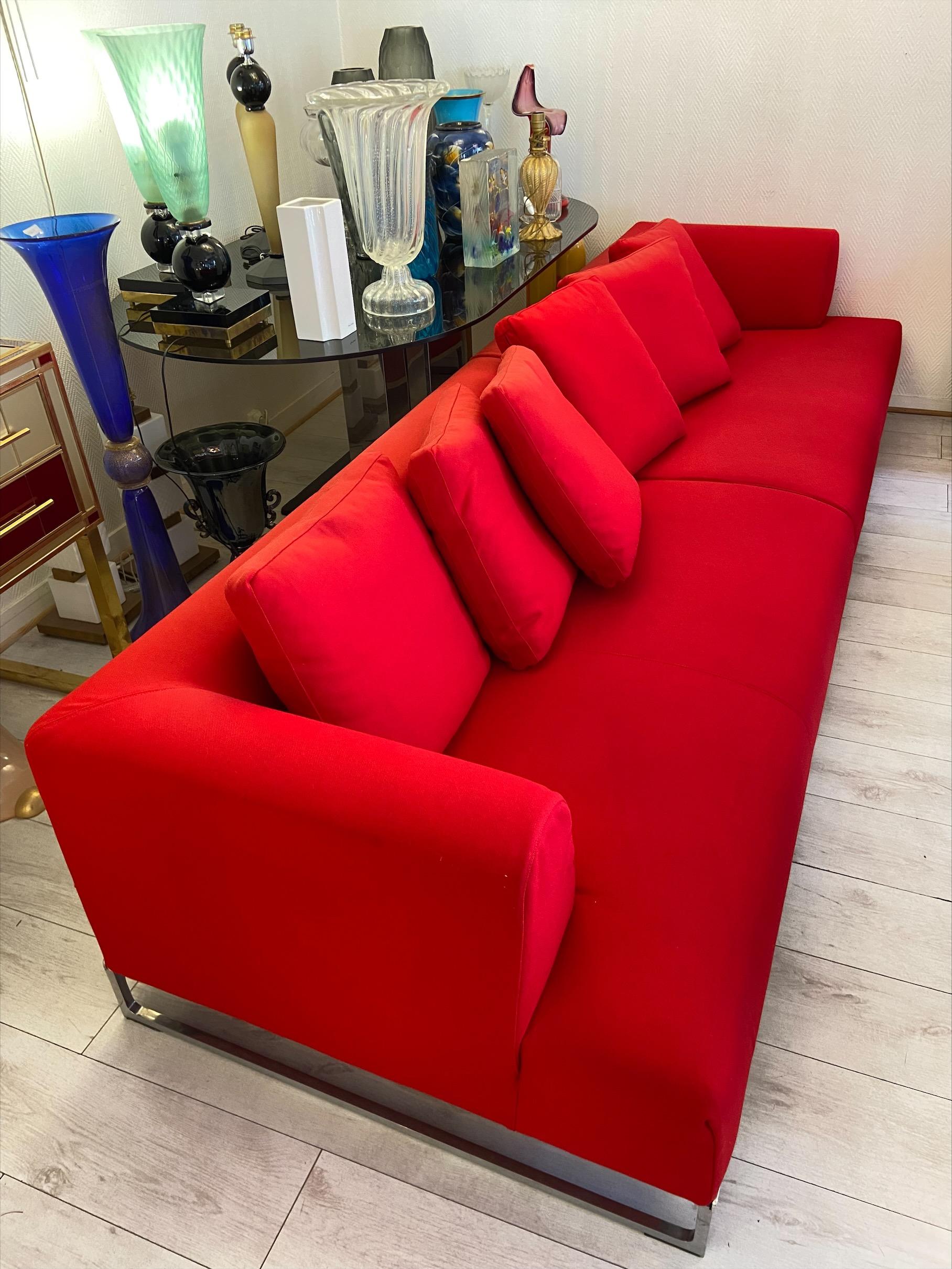 Sofa model Solo - Antonio Citterio
B&B Italia Edition
Red fabric and steel 
Measures: W 270 x D 95 x H 64 cm.
Bright chrome-plated steel 