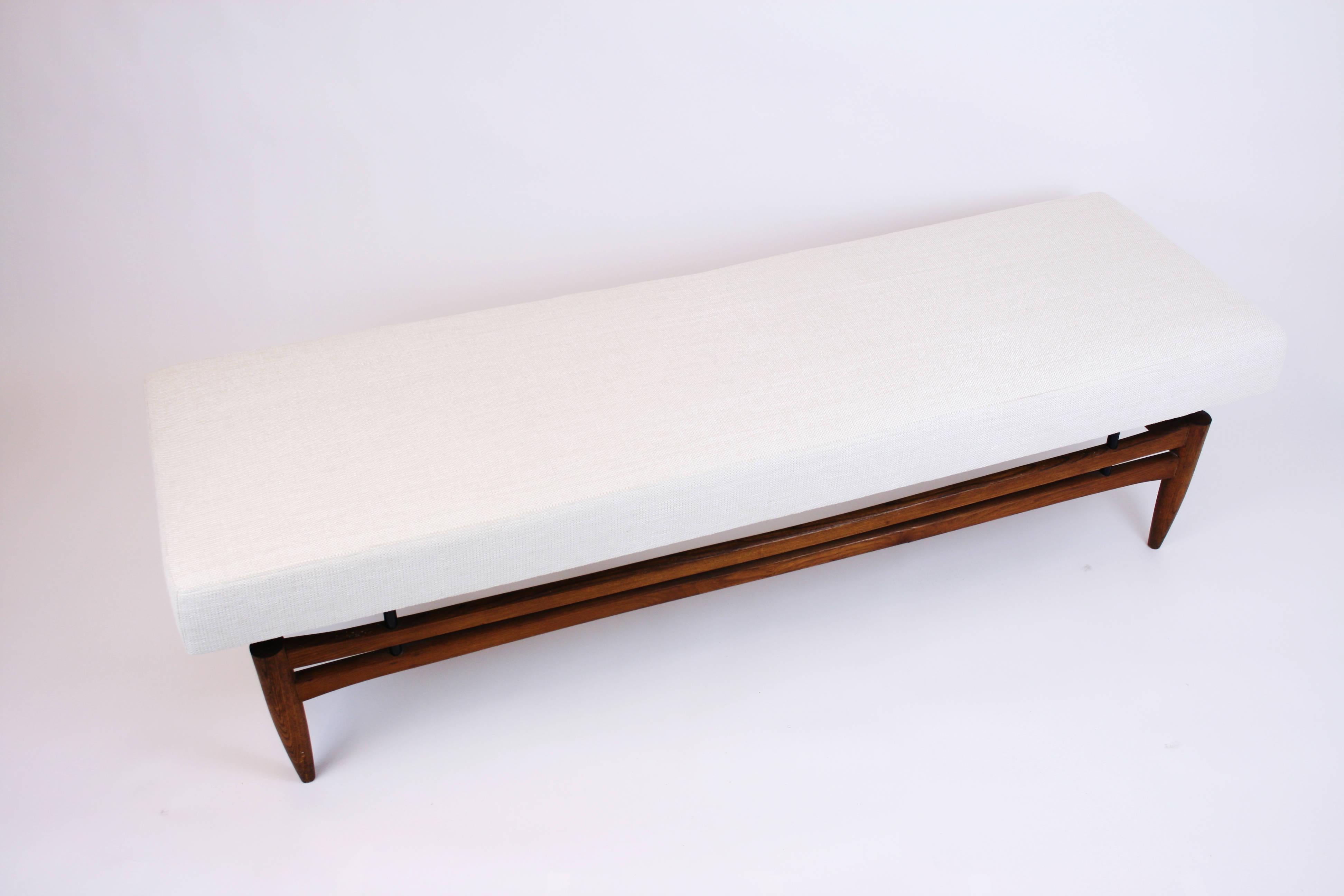 Sofa or setee in the manner of Finn Juhl Danish design teakwood, Denmark, 1960s. Newly upholstered with structured white velor fabric. A very stable piece of furniture that invites you to lie down as well as to sit.