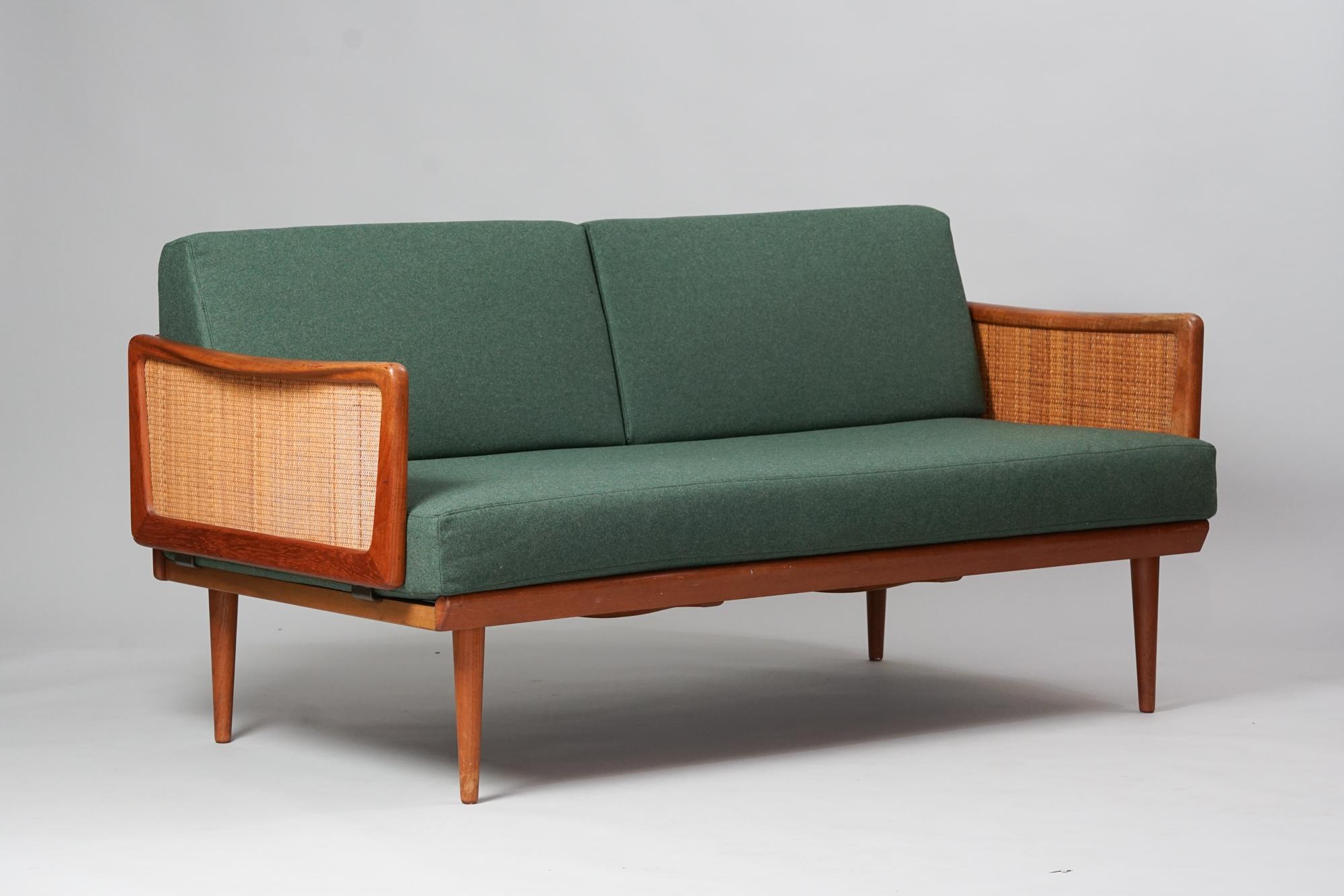 Sofa, designed by Peter Hvidt & Orla Mølgaard-Nielsen, manufactured by France & Son's, 1950s. Teak frame with rattan weaved arm rest sides. Reupholstered with quality Nevotex Wooly -wool fabric. Marked. Good vintage condition, minor patina