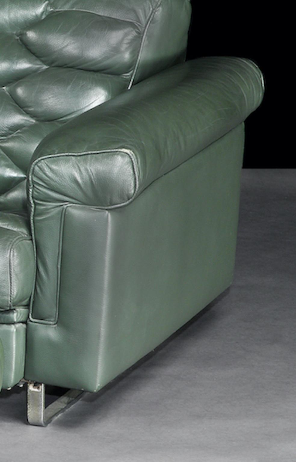 green leather reclining sofa
