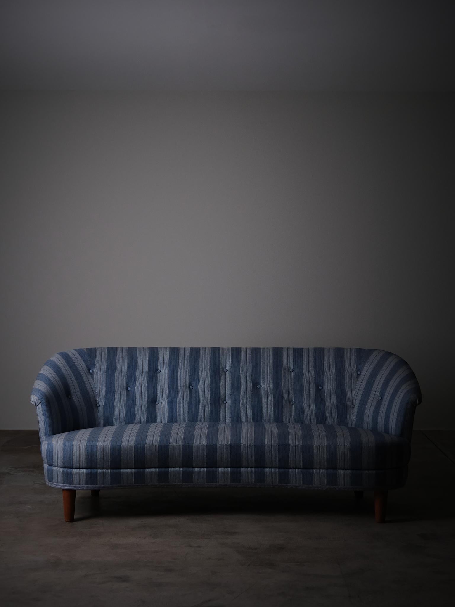 Elegant sofa designed by Carl Malmsten in Sweden during the 1940s. 