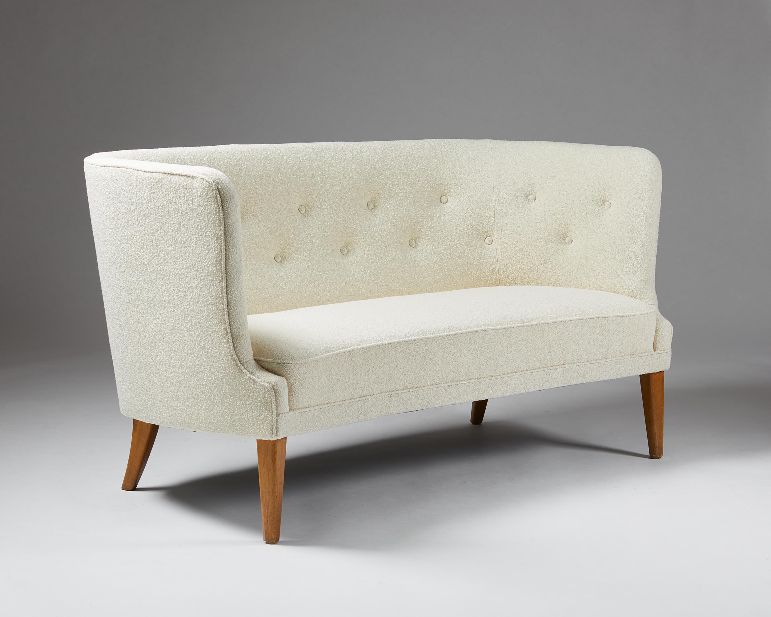 Sofa ‘Royal’ designed by Werner West for Oy Stockmann AB,
Finland, 1950's.

Textile upholstery and lacquered wood legs.

The “Royal” sofa by Werner West is wonderfully comfortable and elegant with its high, enveloping backrest and integrated arms.
