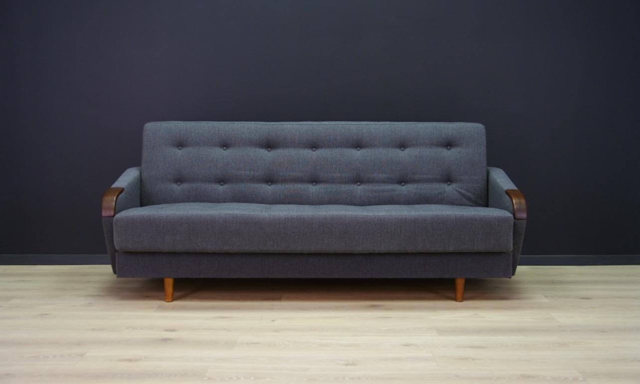 Scandinavian sofa from the 1960s-1970s, Danish design, a minimalistic form with the possibility of sleeping arrangements, and a linen box inside. Phenomenal wooden armrests, upholstery after replacement. Preserved in good condition - directly for