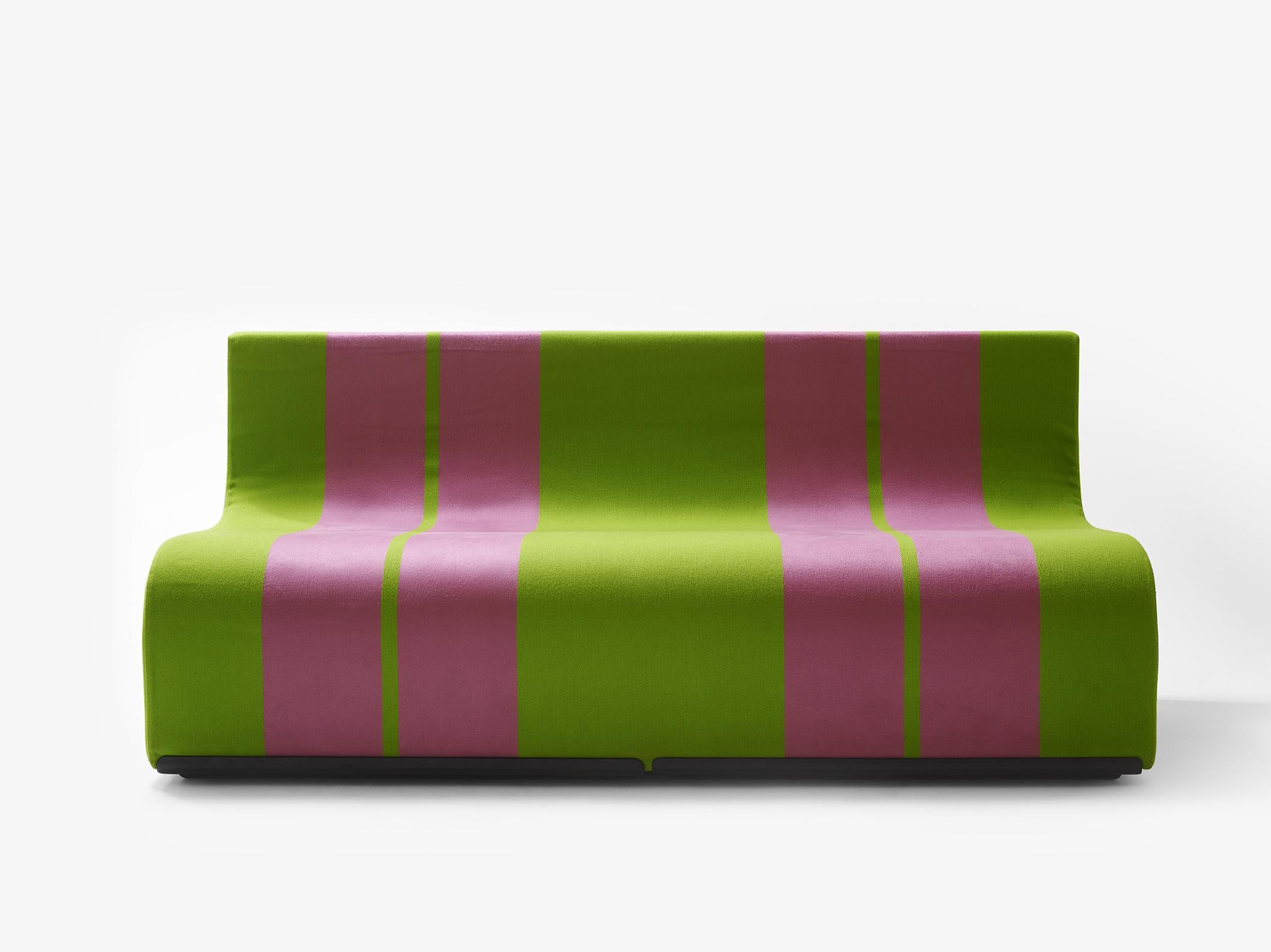 Sofa in polyurethane with base in molded plastic and upholstery in cotton and viscose.

The Sofo is a seat to be placed in a row, like a train, or to be stacked to build solid colored mountains.
It is just a block, obtained by means of an “S”