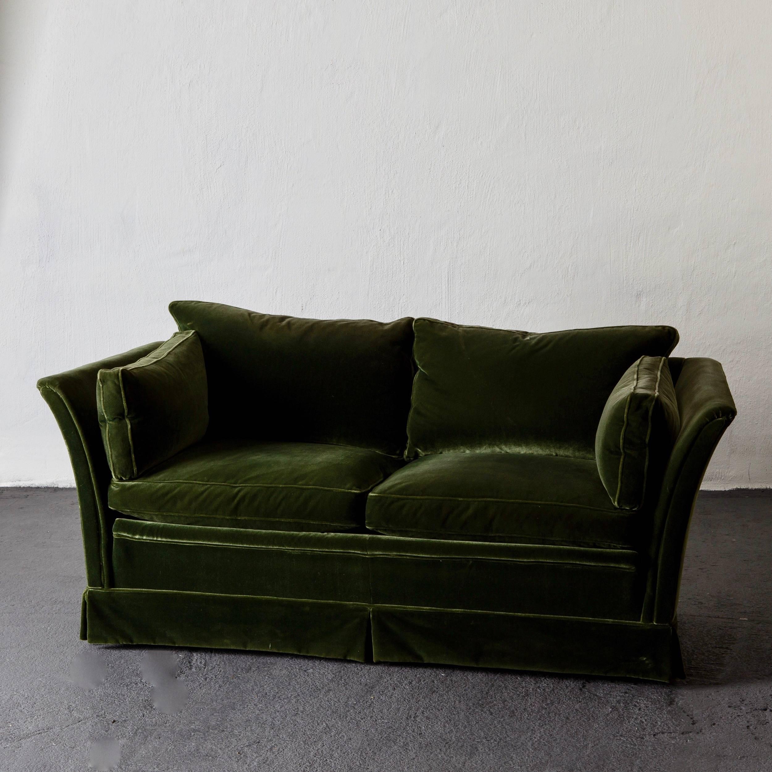 Sofa Swedish mid-20th century green velvet, Sweden. A sofa made during the 1950s in Sweden. Upholstered in dark green velvet. Loose cushions in back and seat and armrests.